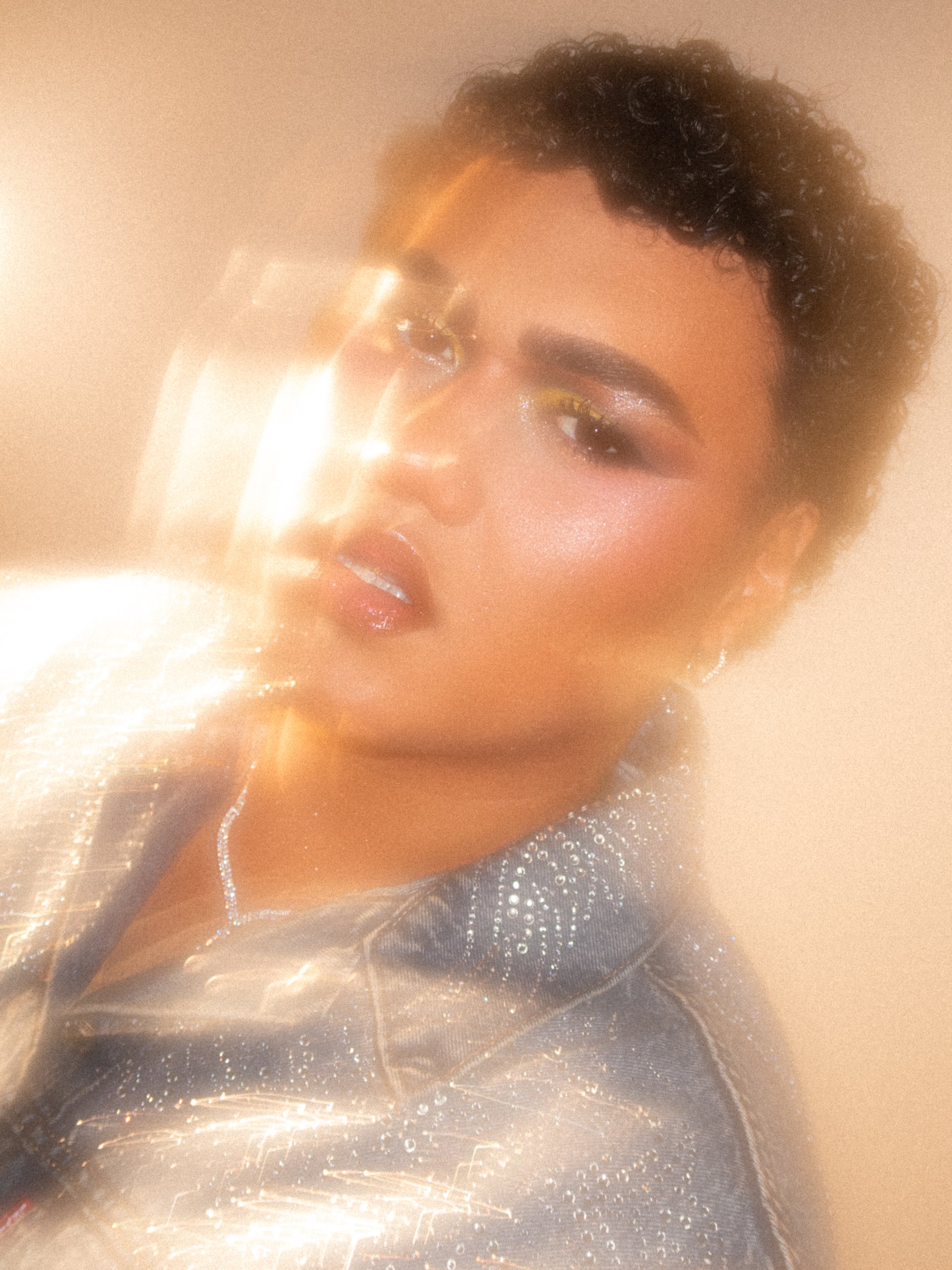 Kylee De Thier in a yellow cut crease for NEON Streaming NZ, wearing YSL Beauty and Levi's Beyonce Denim Collection with rhinestones