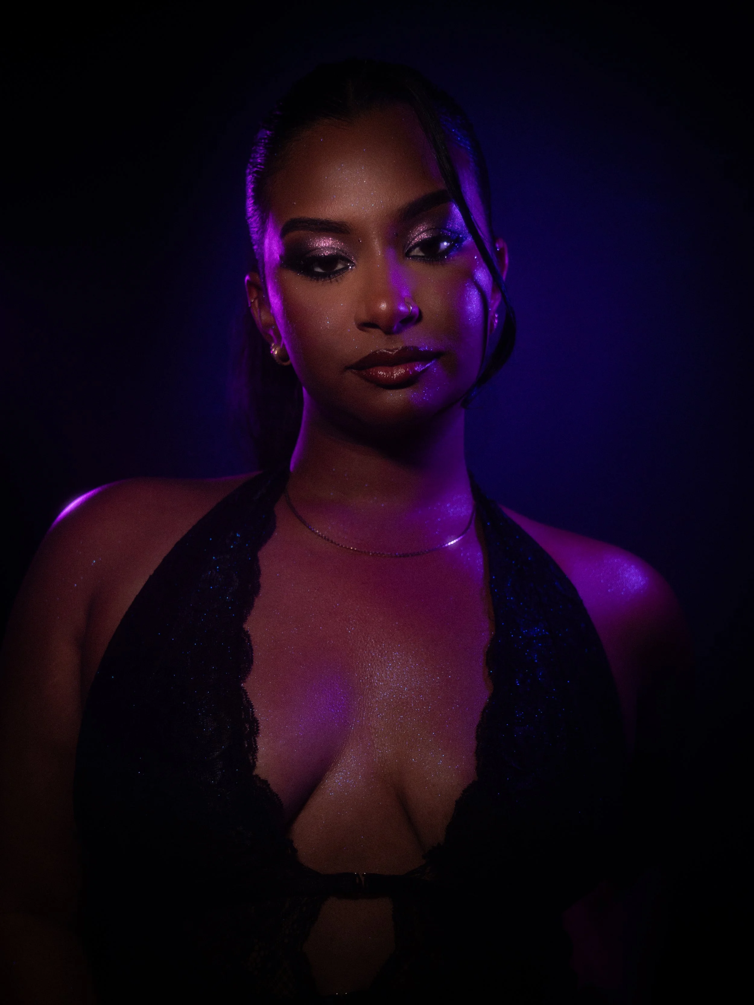 Nikita Chaithoo in a purple glitter makeup look created by makeup artist Kylee De Thier, photography and cinematography by Kylee De Thier