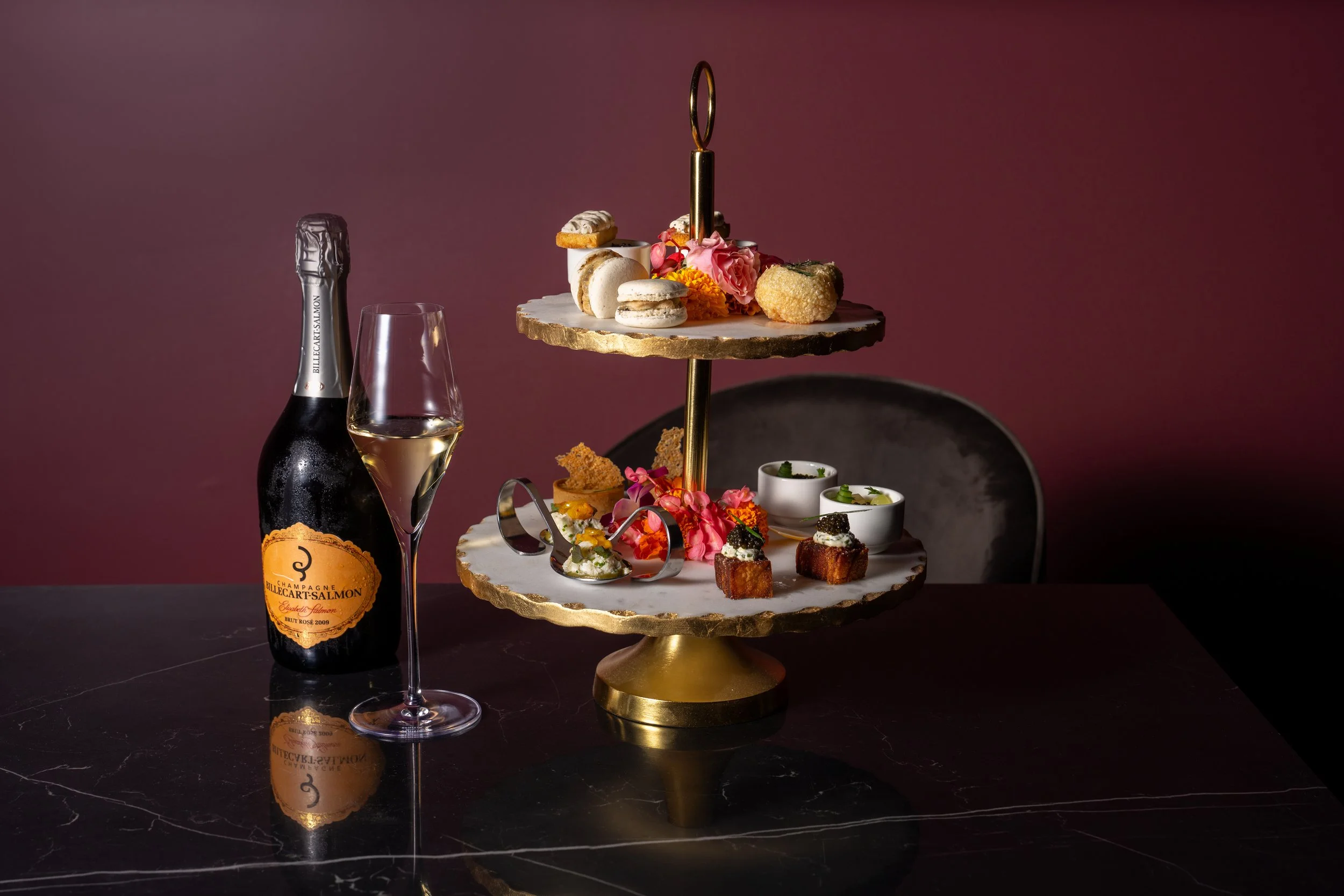 Image of Exquisite hors d’oeuvres served a la carte with a bottle of champagne and a glass
