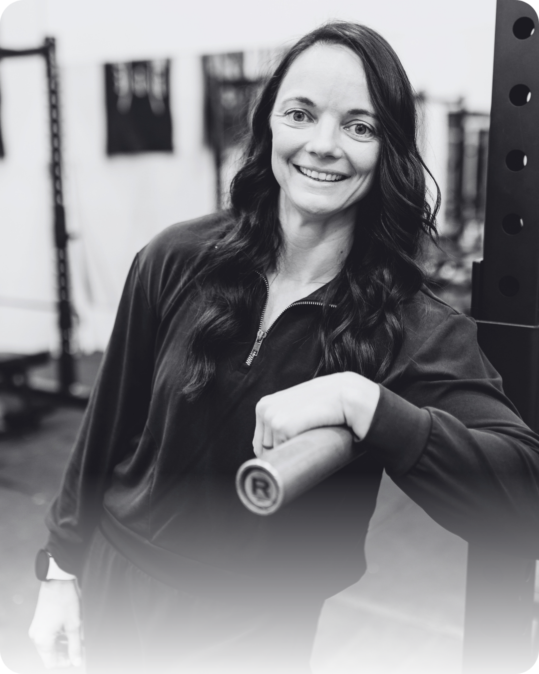 A black and white photo of a family of seven outdoors, including three adult women and men, and four children, with trees in the background.
