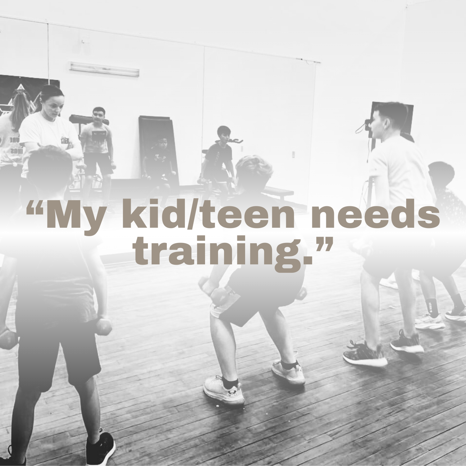 Children engaging in a fitness training or exercise session in a gym or indoor sports facility, supervised by adult instructor.