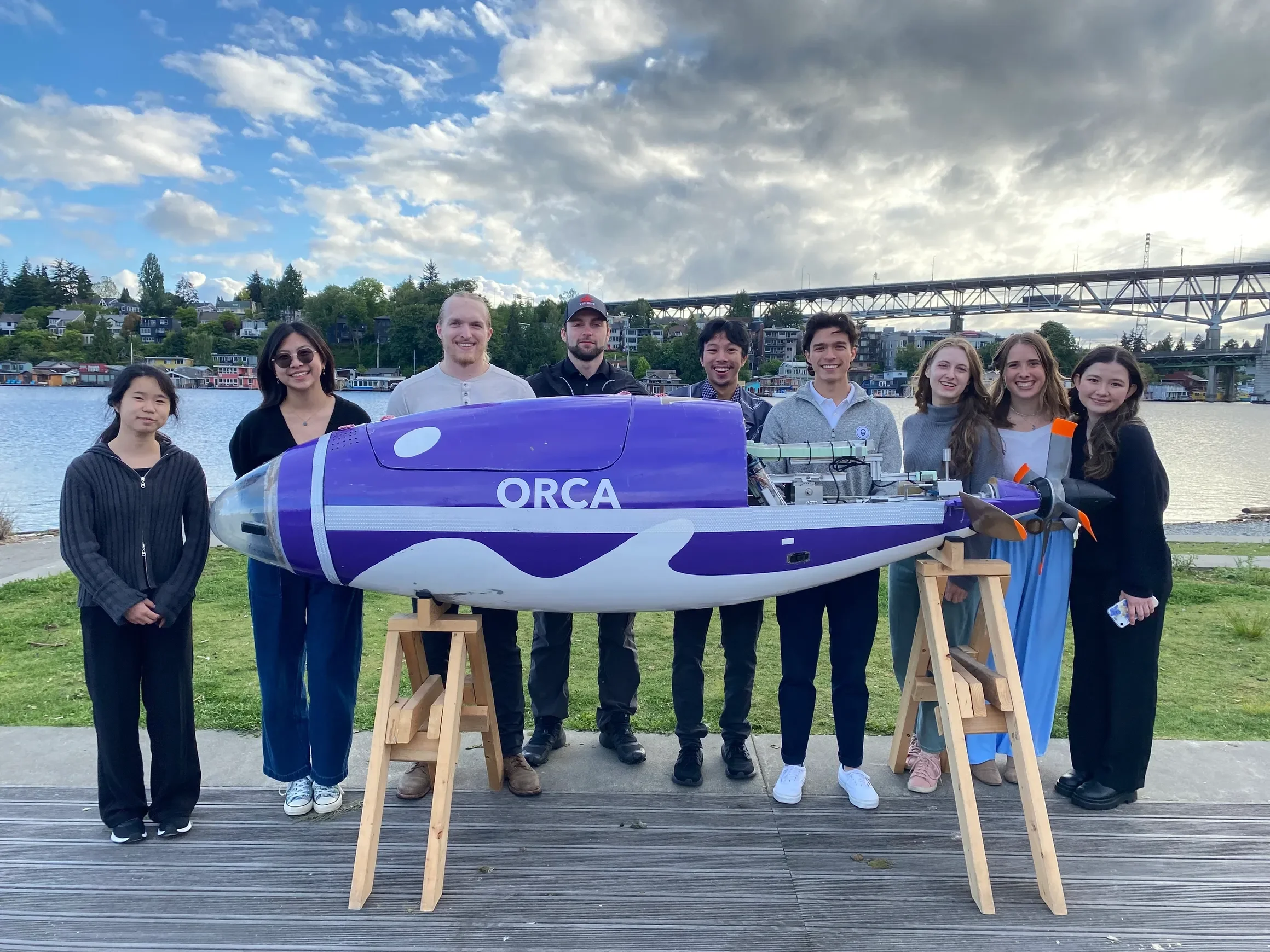 HPS leads pose with Orca with Portage Bay in the background