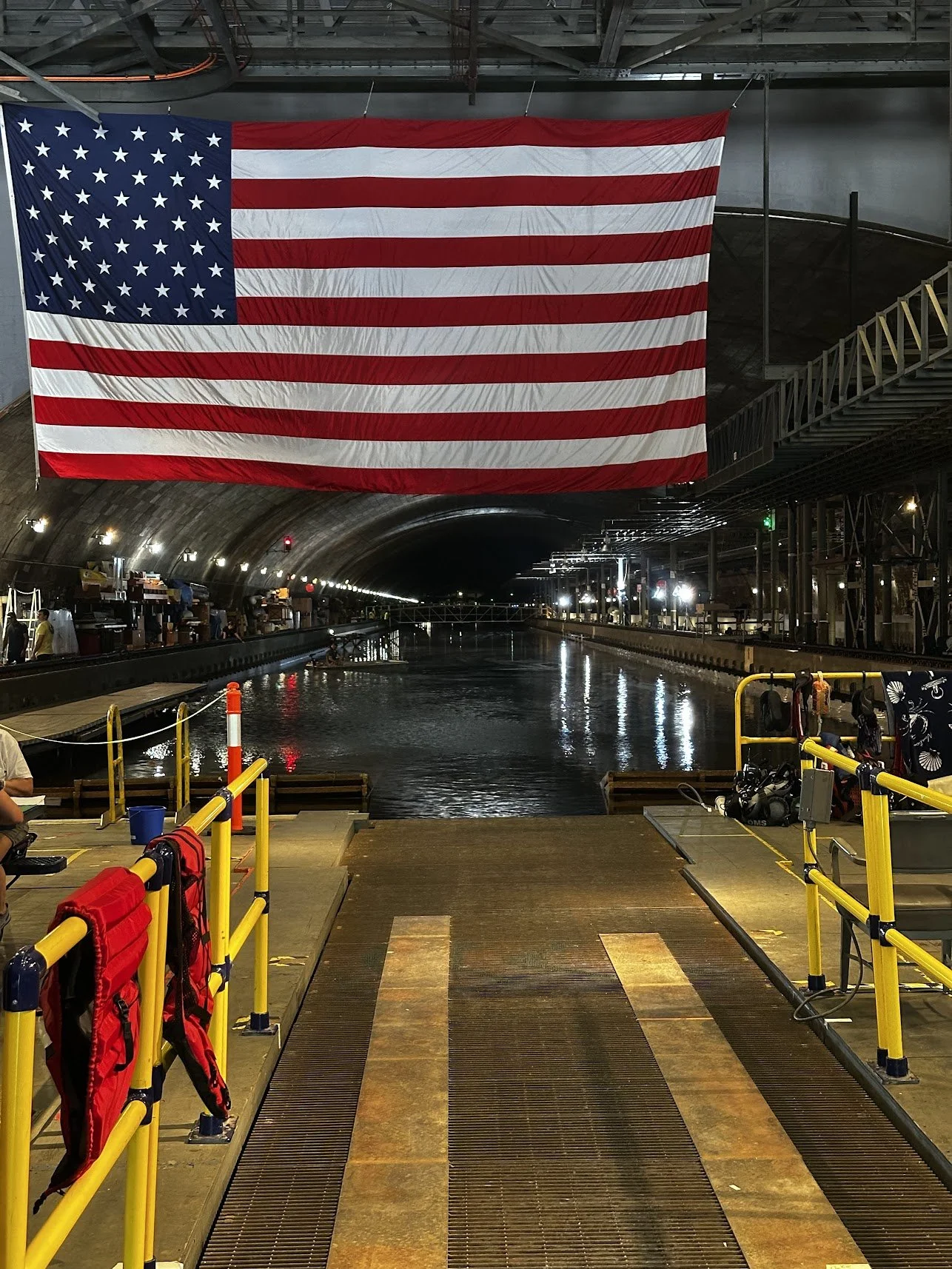 Looking down the pool in Carderock, MD (ISR) without an end in site with a large American Flag hanging down.