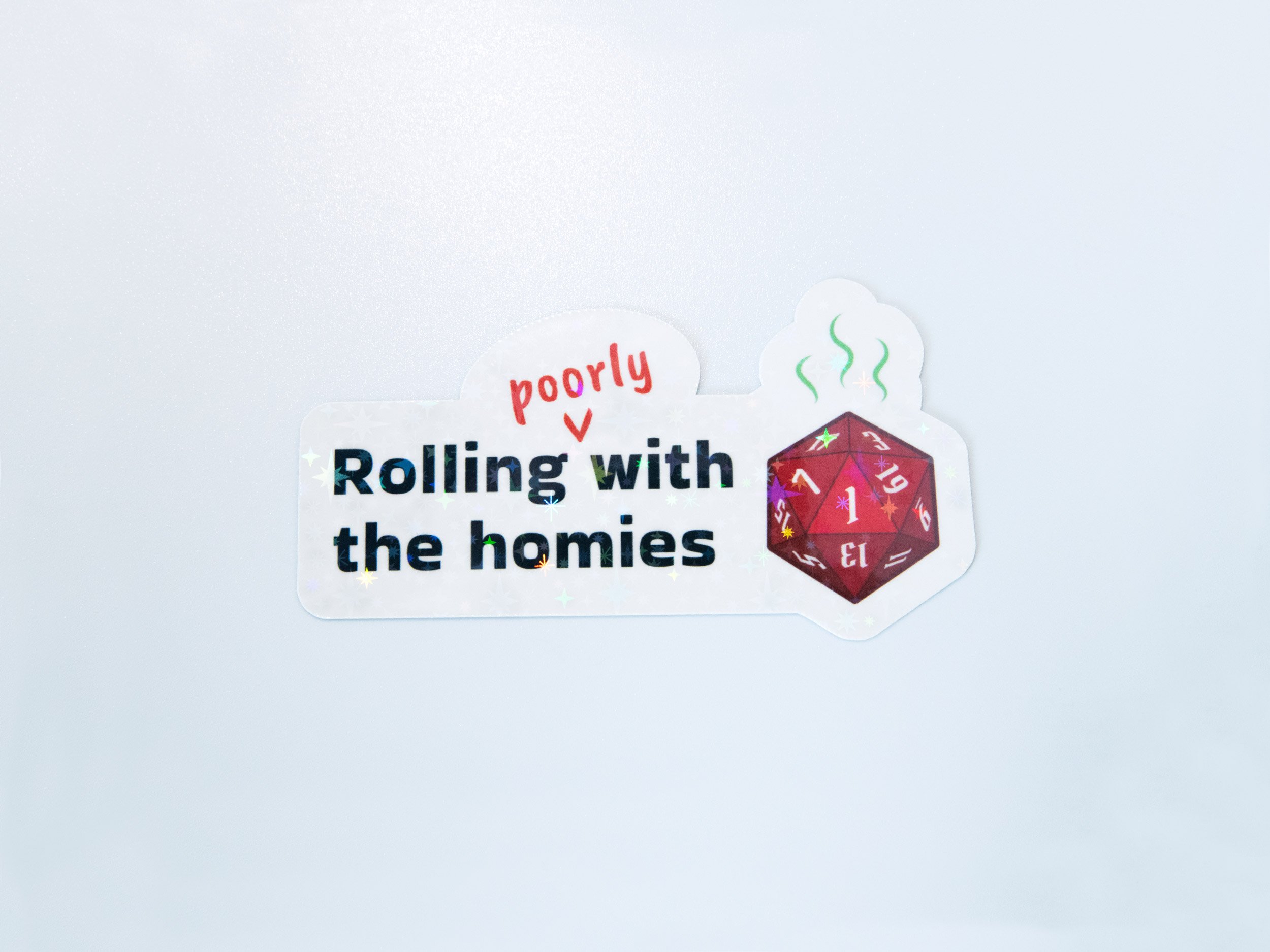 "Rolling poorly with the homies" sticker with a holographic stars finish