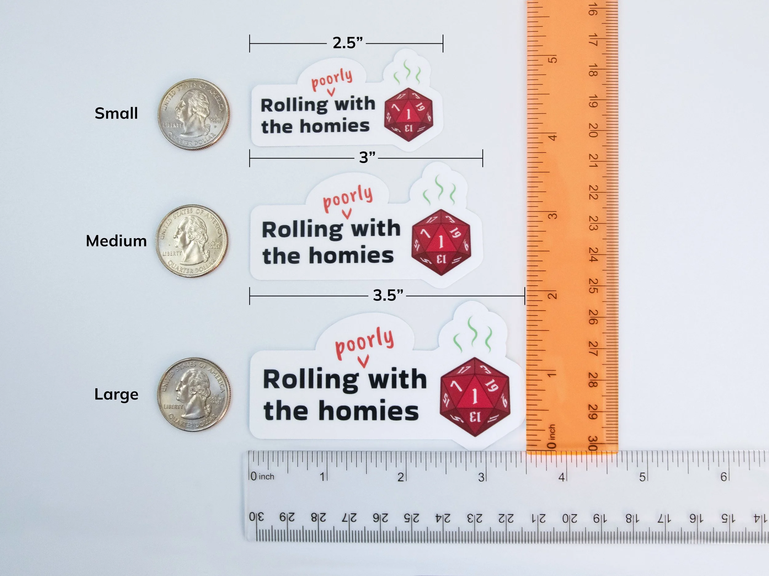 Examples of all 3 sticker sizes next to rulers and quarters to show scale. Small is 2.5” wide, medium is 3” wide, and large is 3.5” wide