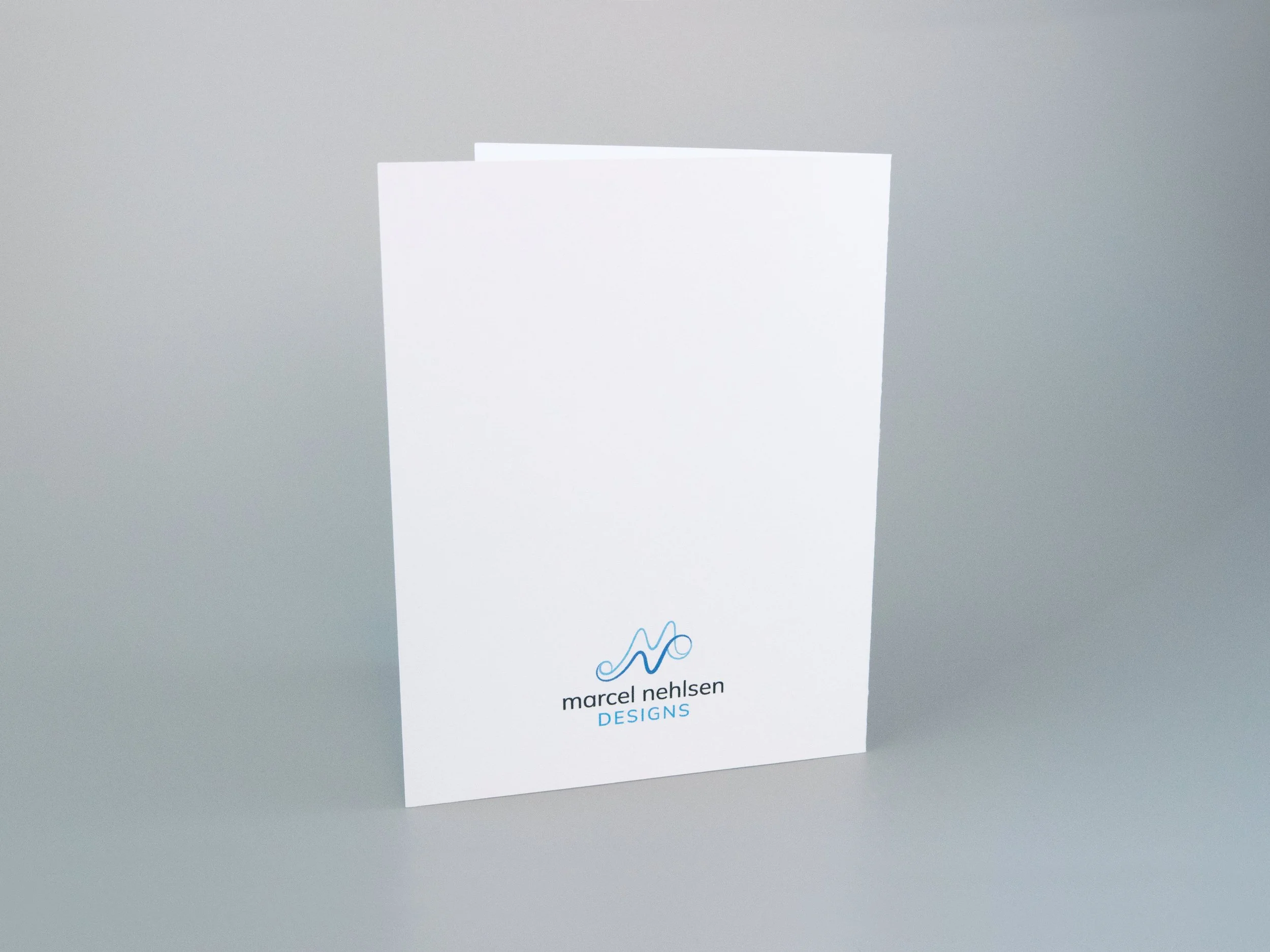 Back view of a greeting card. There is a Marcel Nehlsen Designs logo at the bottom