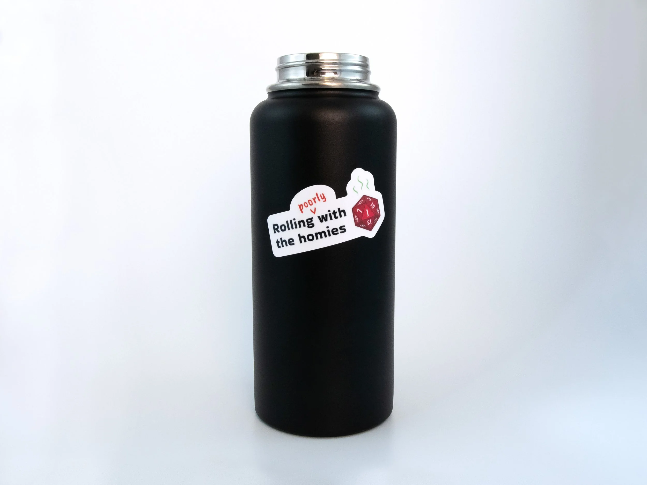 A sticker of a red d20 die with text that says “Rolling poorly with the homies”. The sticker is on a black water bottle
