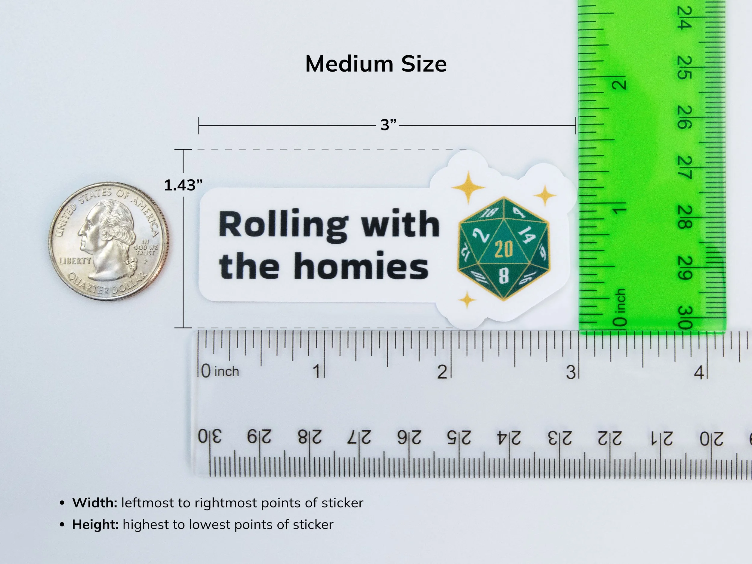Example of the medium sticker size next to rulers and a quarter to show scale. The sticker is 3” wide and 1.43” tall