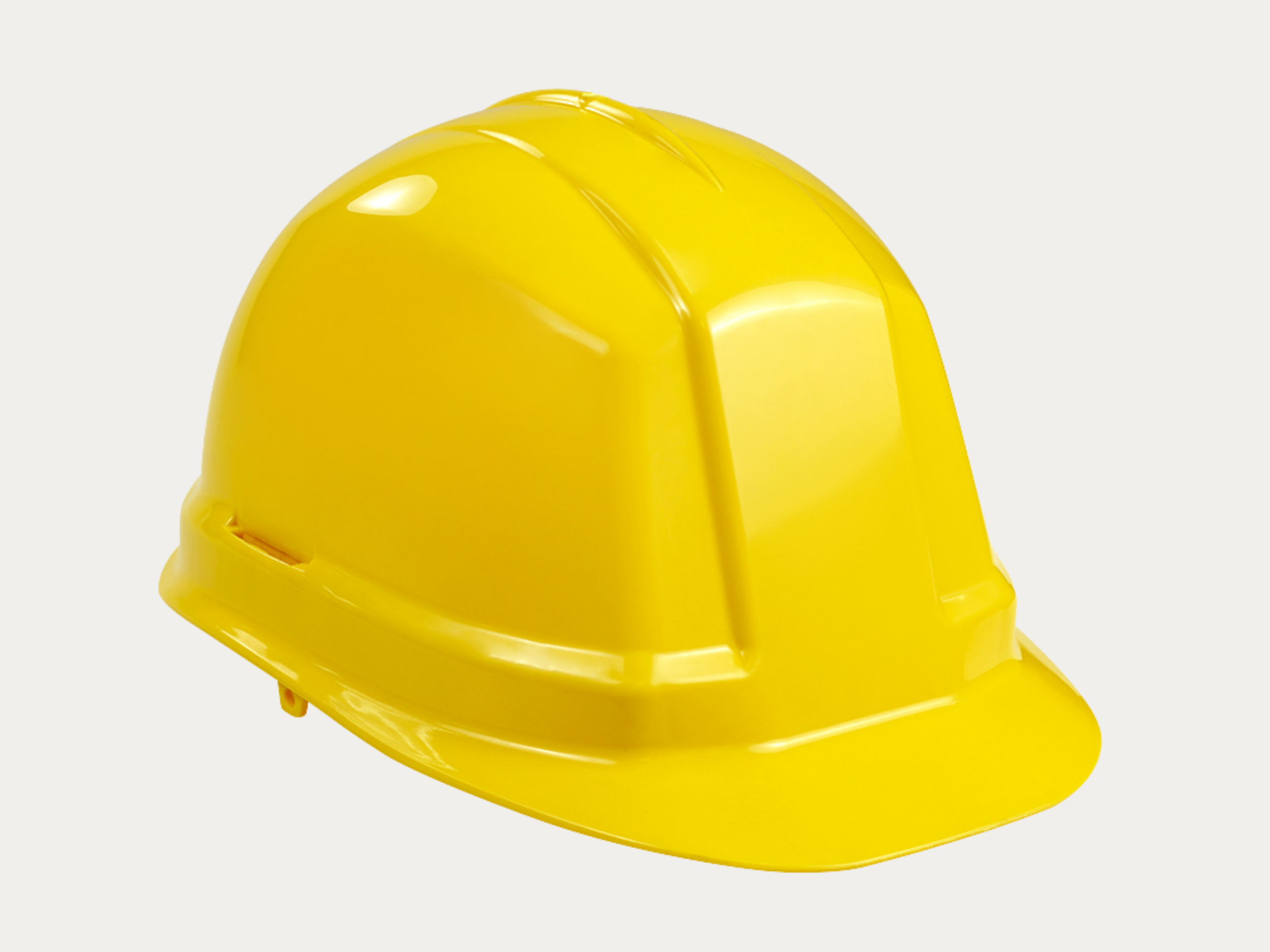 Yellow construction safety helmet against a light background.