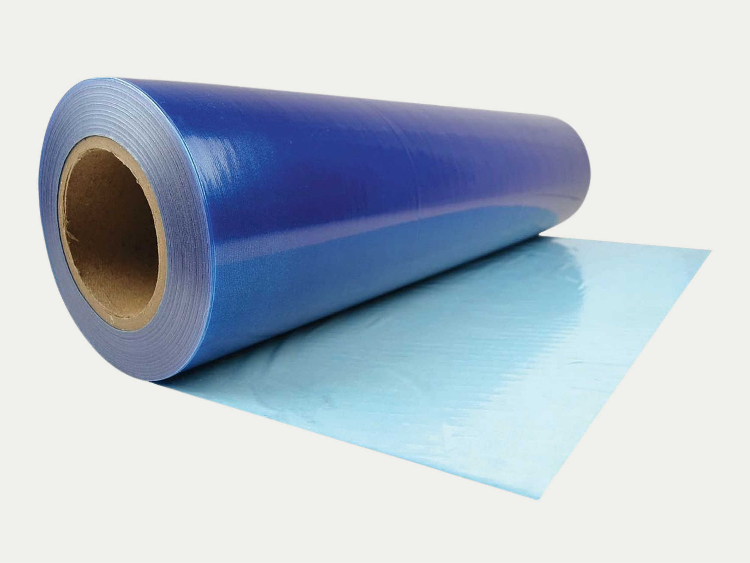 A large blue roll of plastic or vinyl material partially unrolled on a white background.