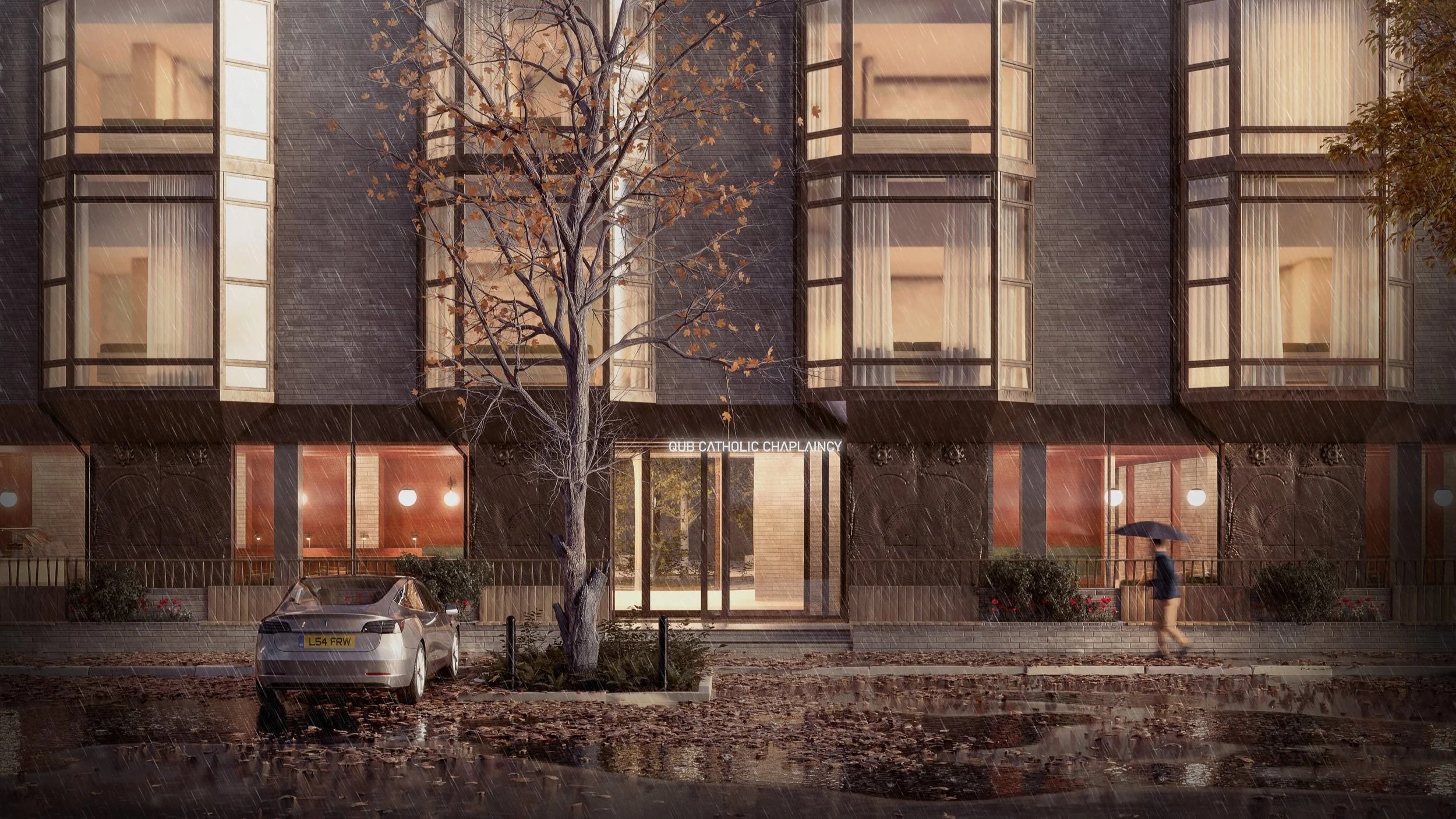 Rainy night scene outside a modern building labeled 'QUB Catholic Chaplaincy,' with a person holding an umbrella walking on the sidewalk, a parked car, and a leafless tree in the foreground.