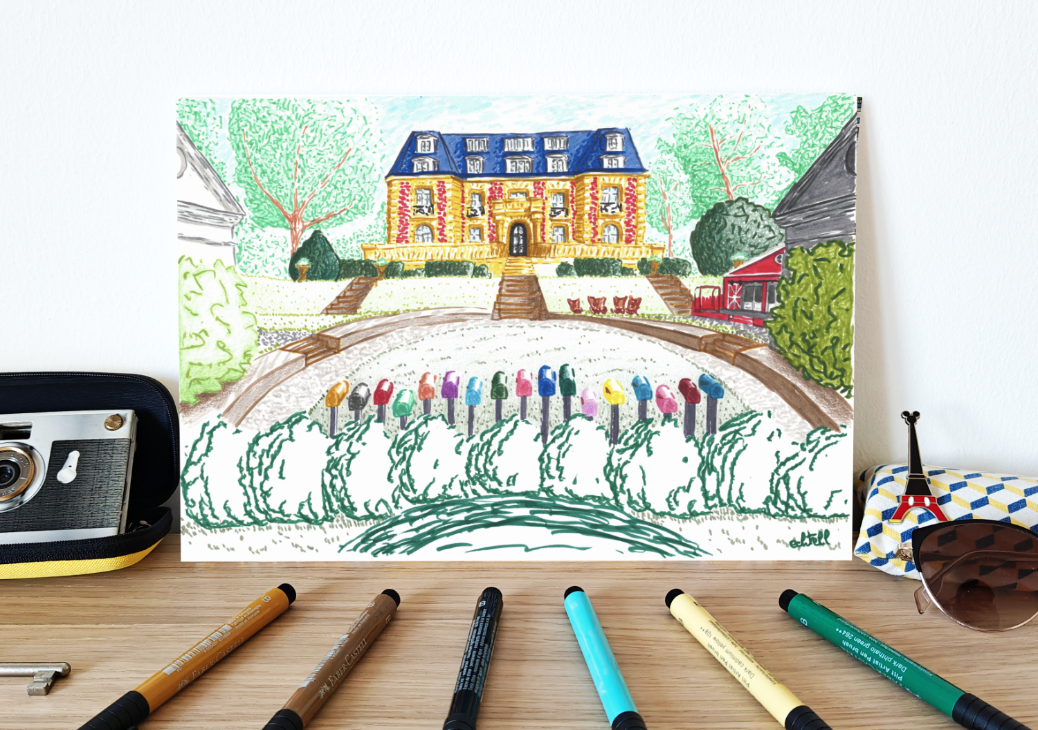Affiche du Château de la Star Academy à Dammarie-les-Lys posée sur un meuble en décoration murale avec des feutres colorés. Château des Vives Eaux style classique Paris XVIIIe siècle. Illustration à la main Yvelines Echtell Art Versailles artiste
