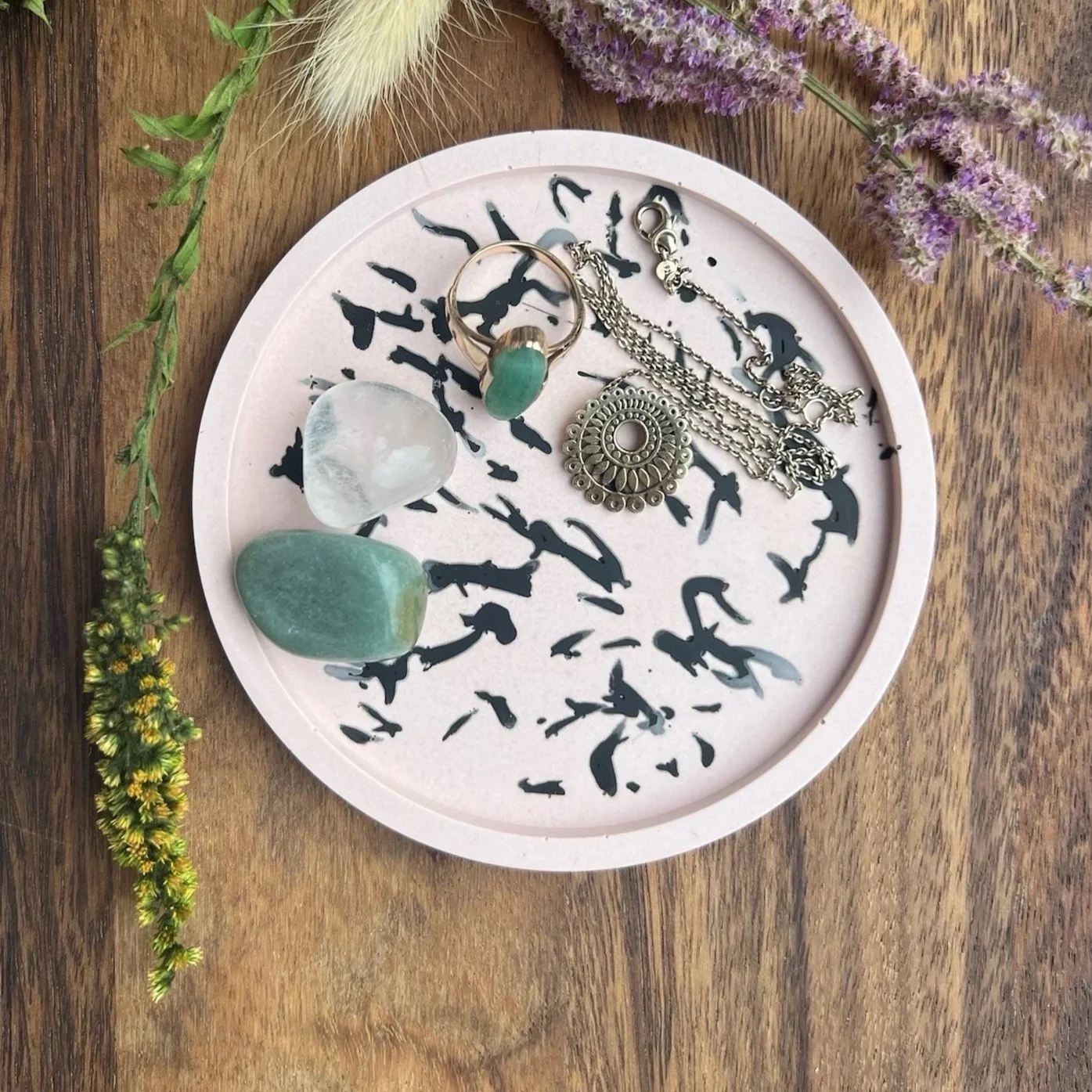 a jesmonite workshop coaster used as a ring tray