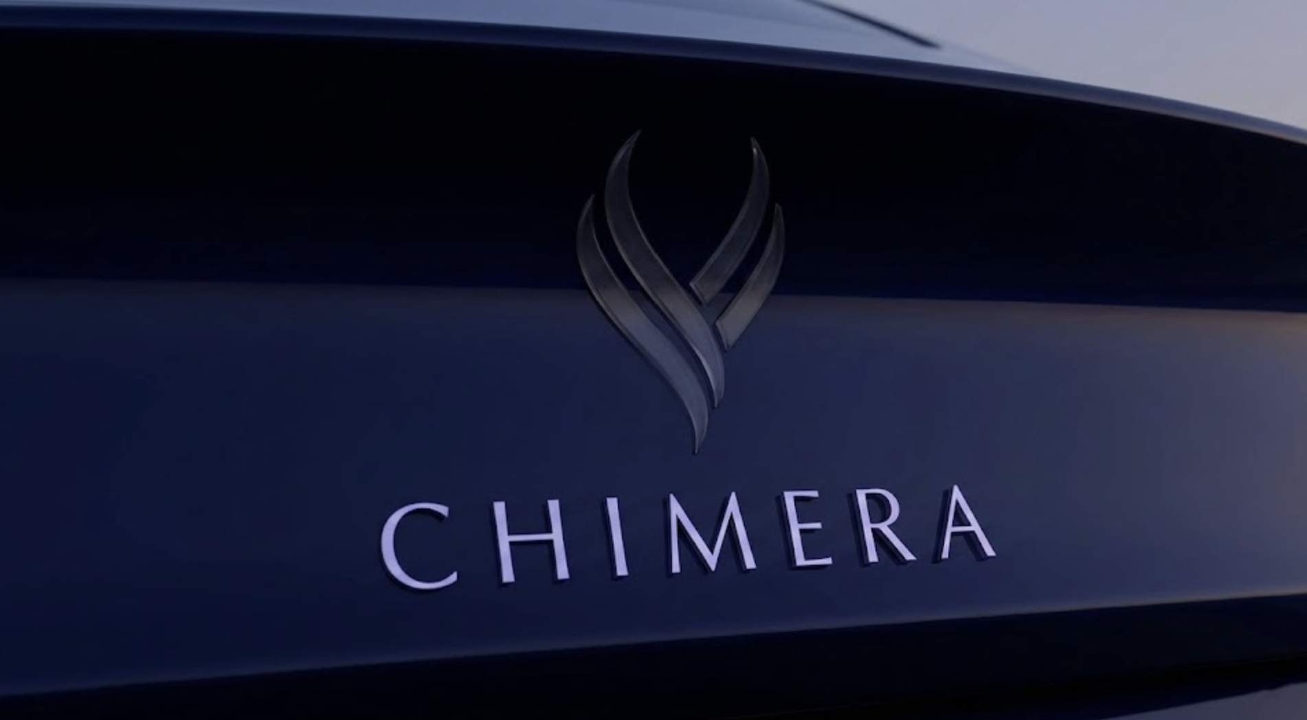 Rear of a car with a flame logo and the word Chmera on it
