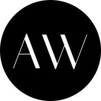 Black circle with white initials 'A W' in the center