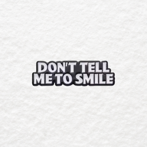 Don't Tell Me to Smile enamel pin