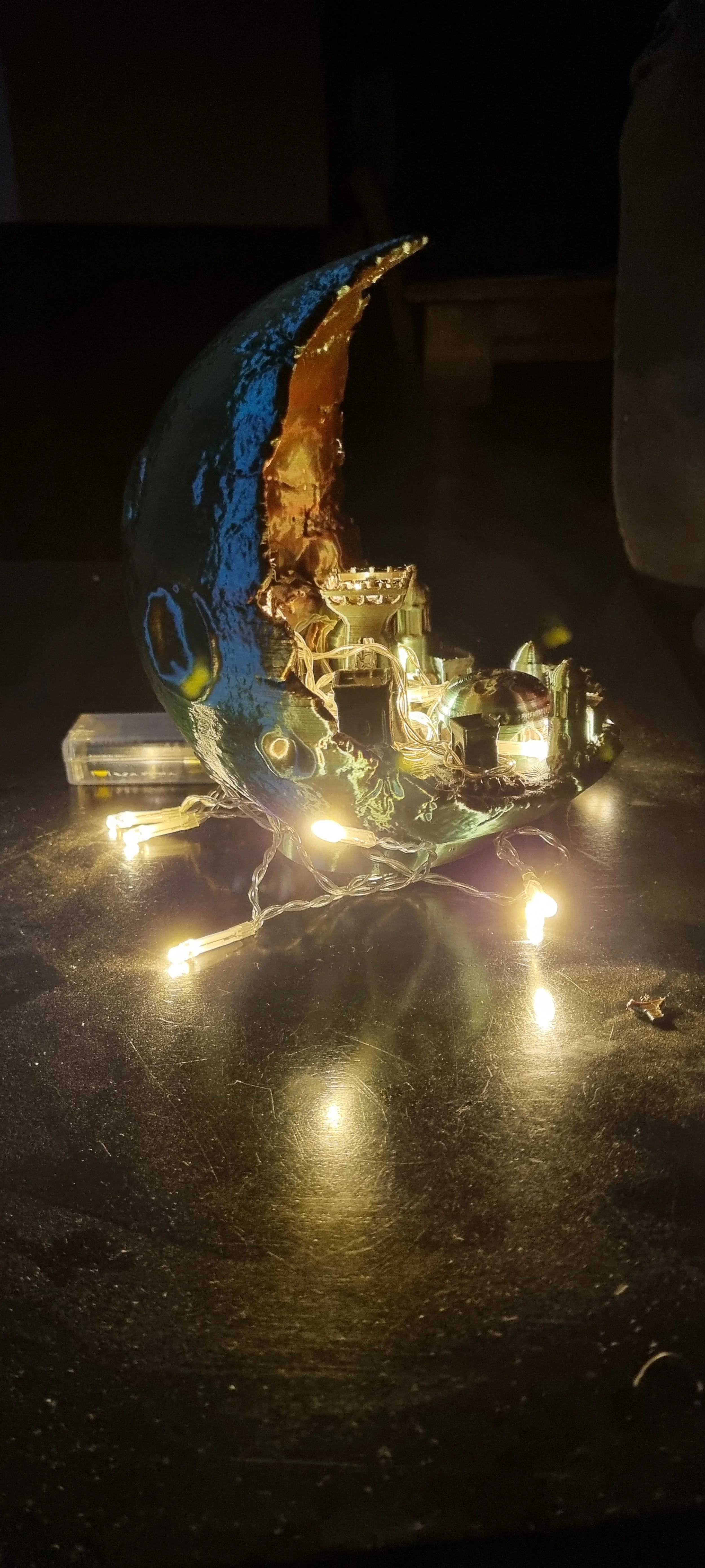 Side on moon city lit up 