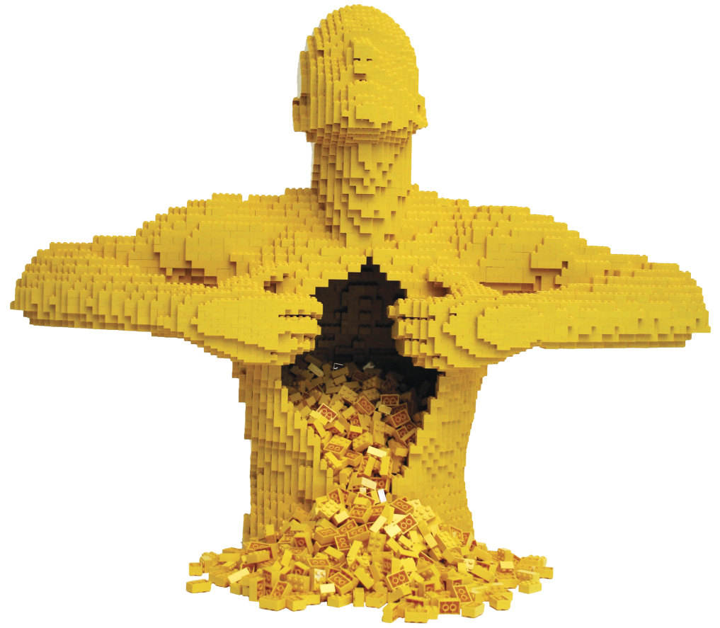 A sculpture of a human torso and head made from yellow LEGO bricks, with an opening in the stomach area appearing to pour out LEGO bricks.