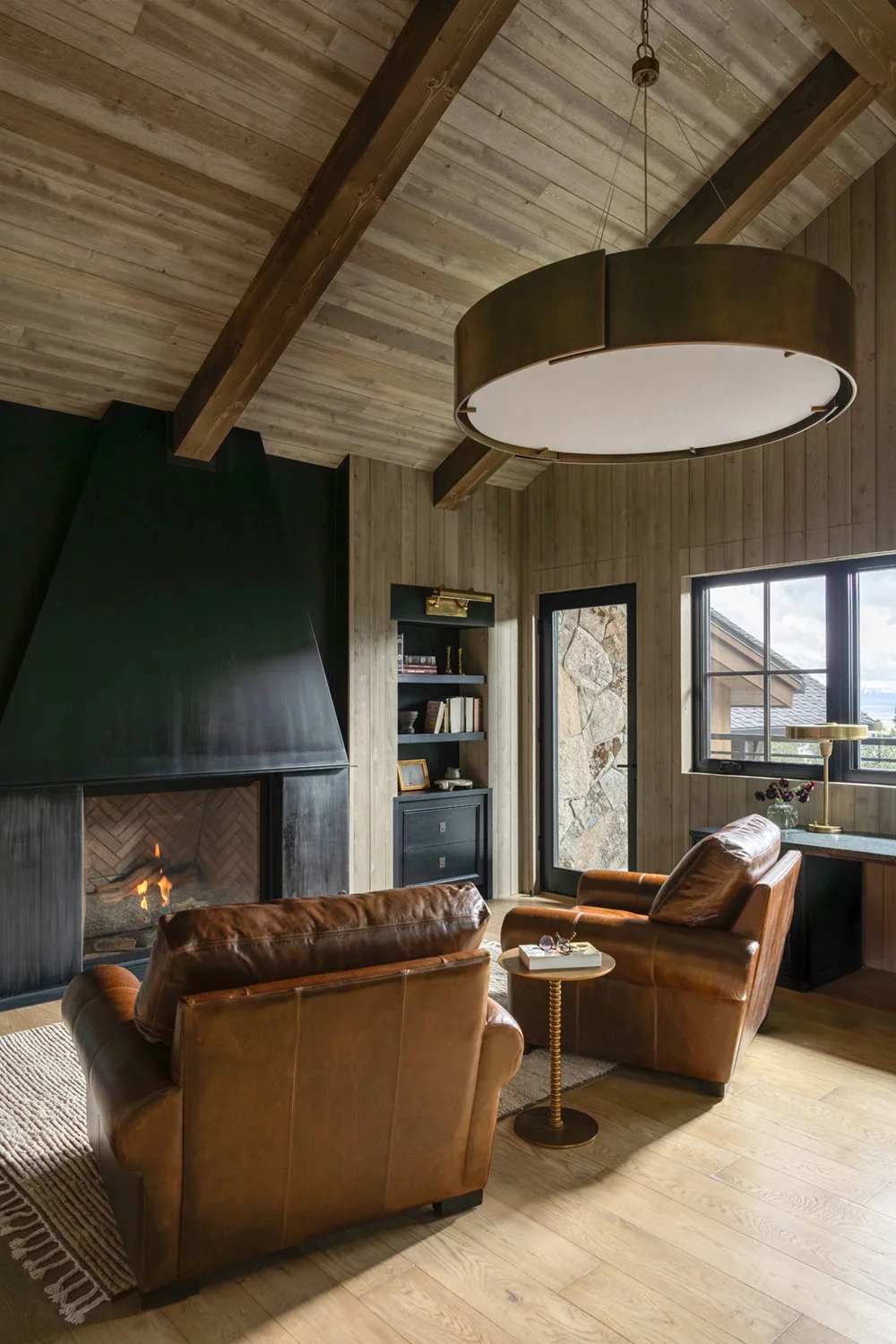 lounge room with chairs and fireplace