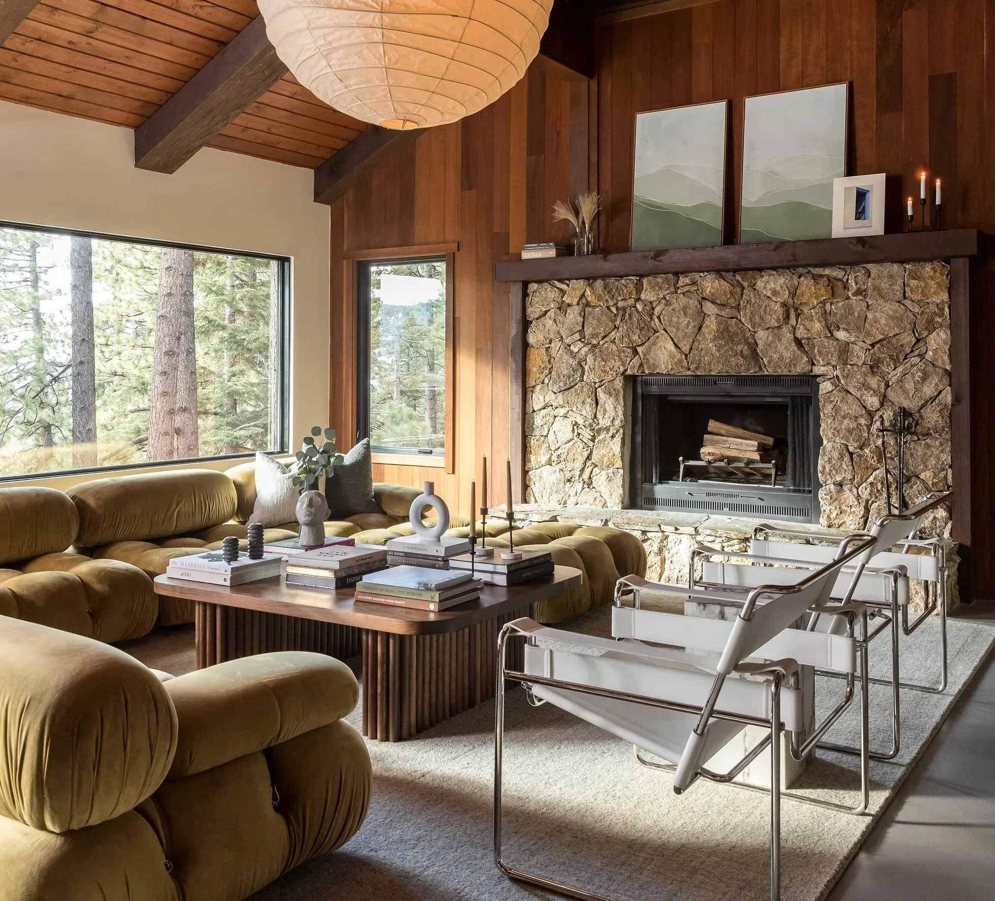 living room with stone fireplace