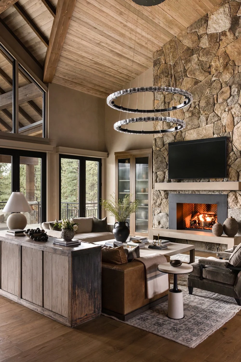 living room with stone fireplace