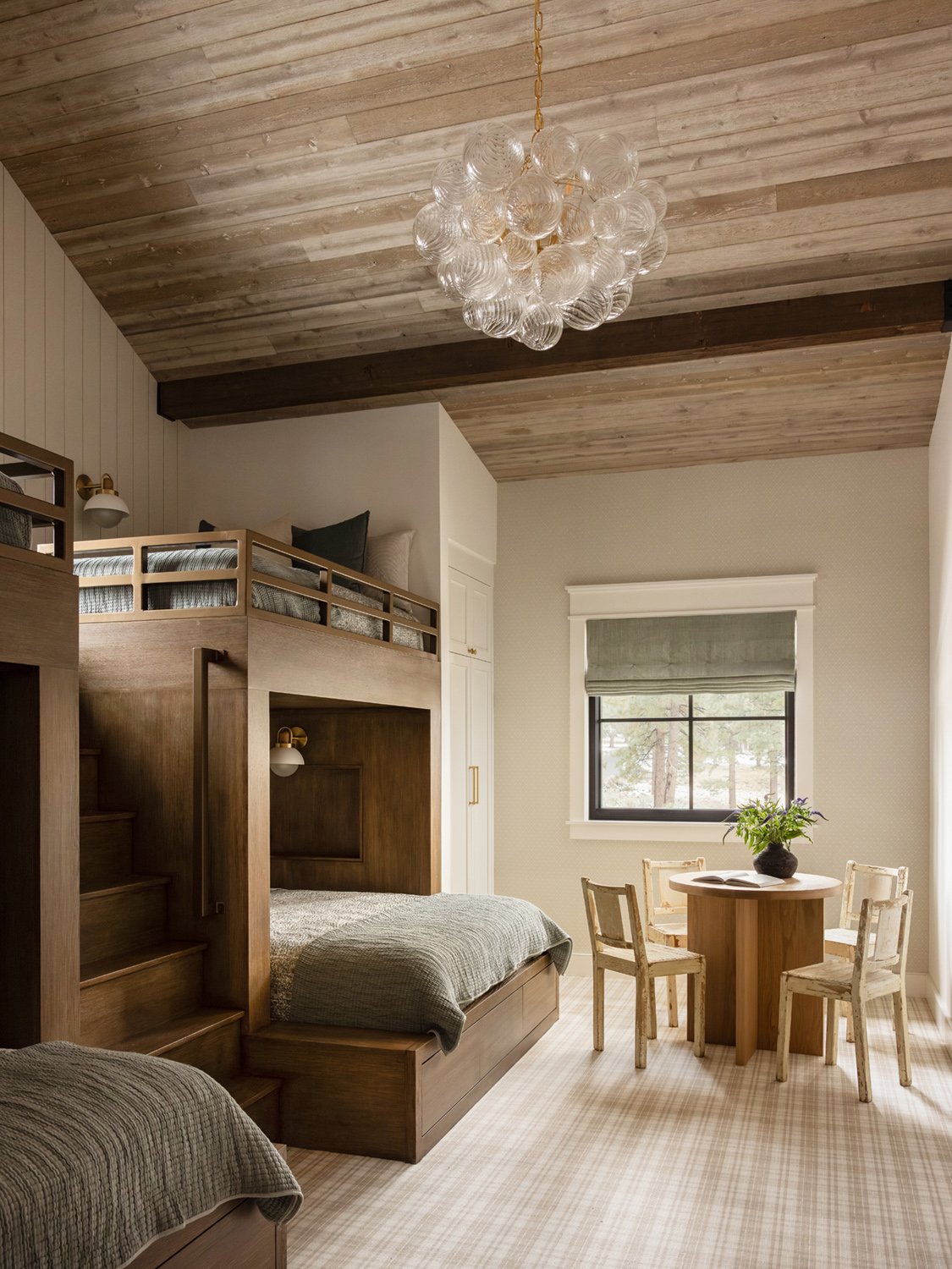 guest bedroom with bunk beds and table
