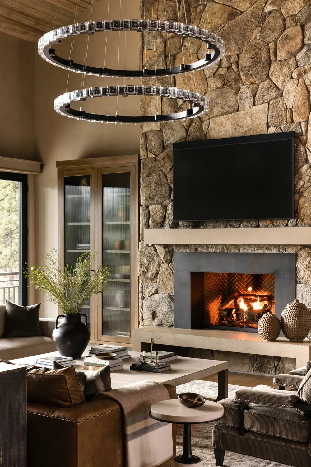 living room with stone fireplace