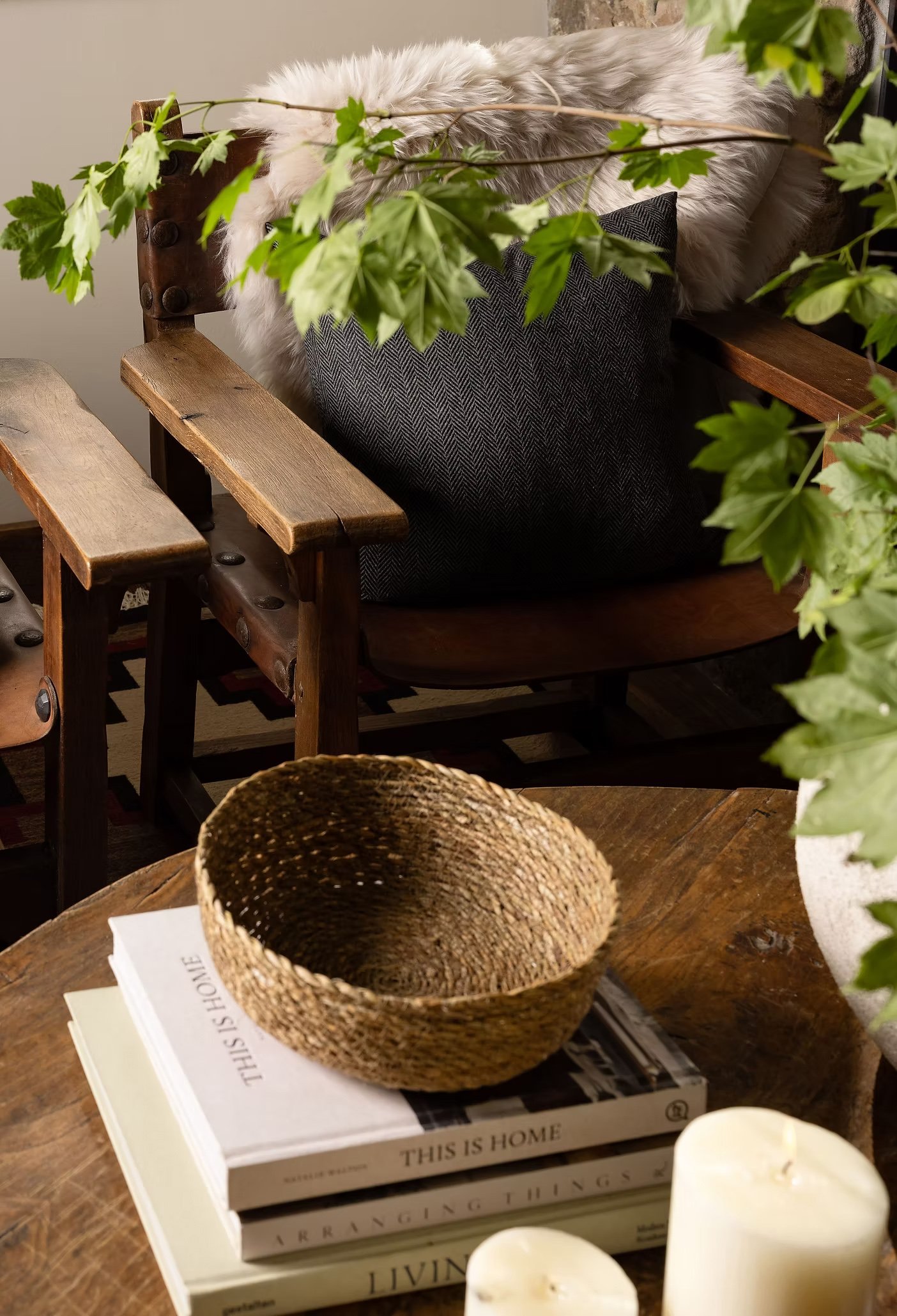 detail shot of coffee table, books, basket, candles