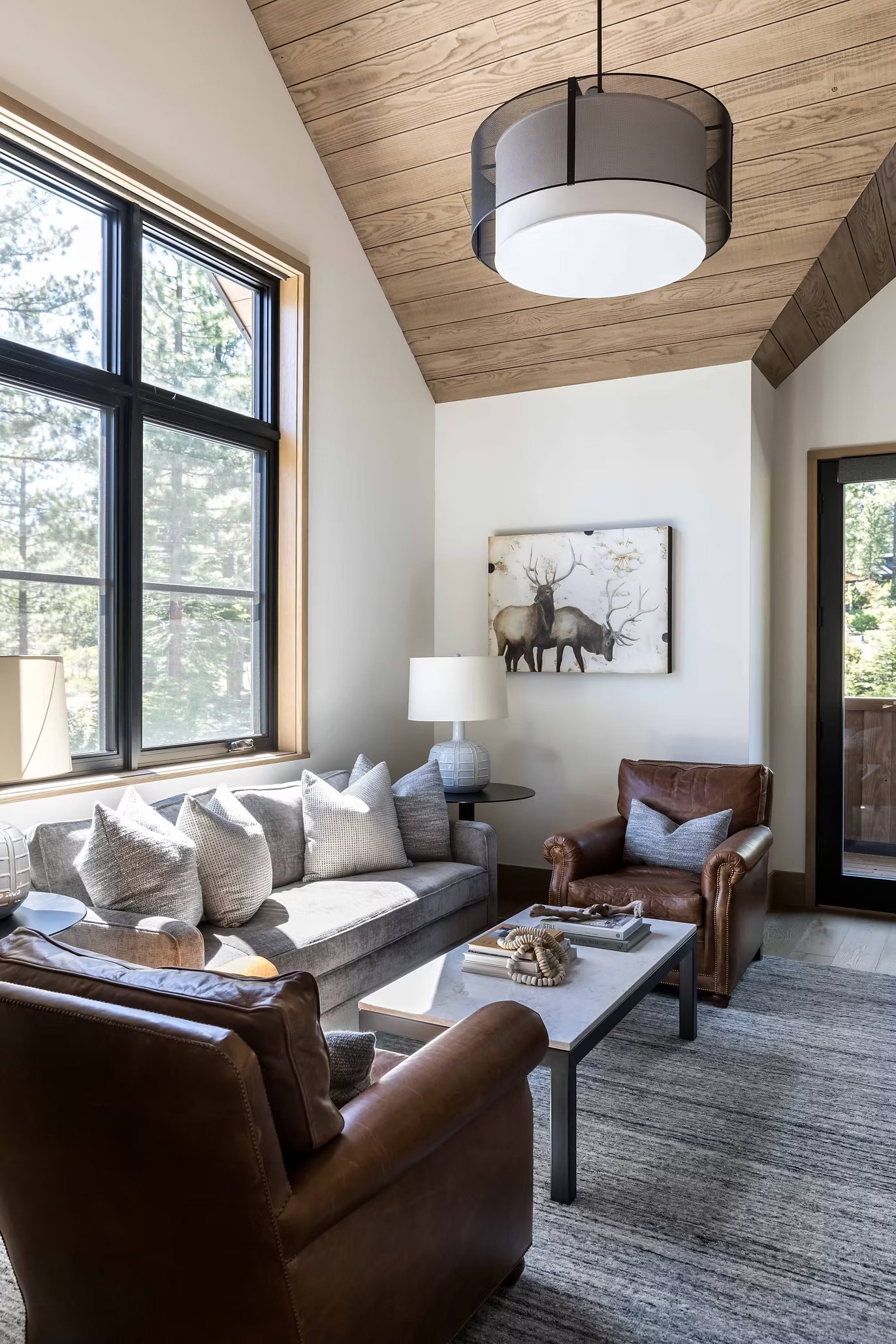 sitting area with couch, chairs, and table