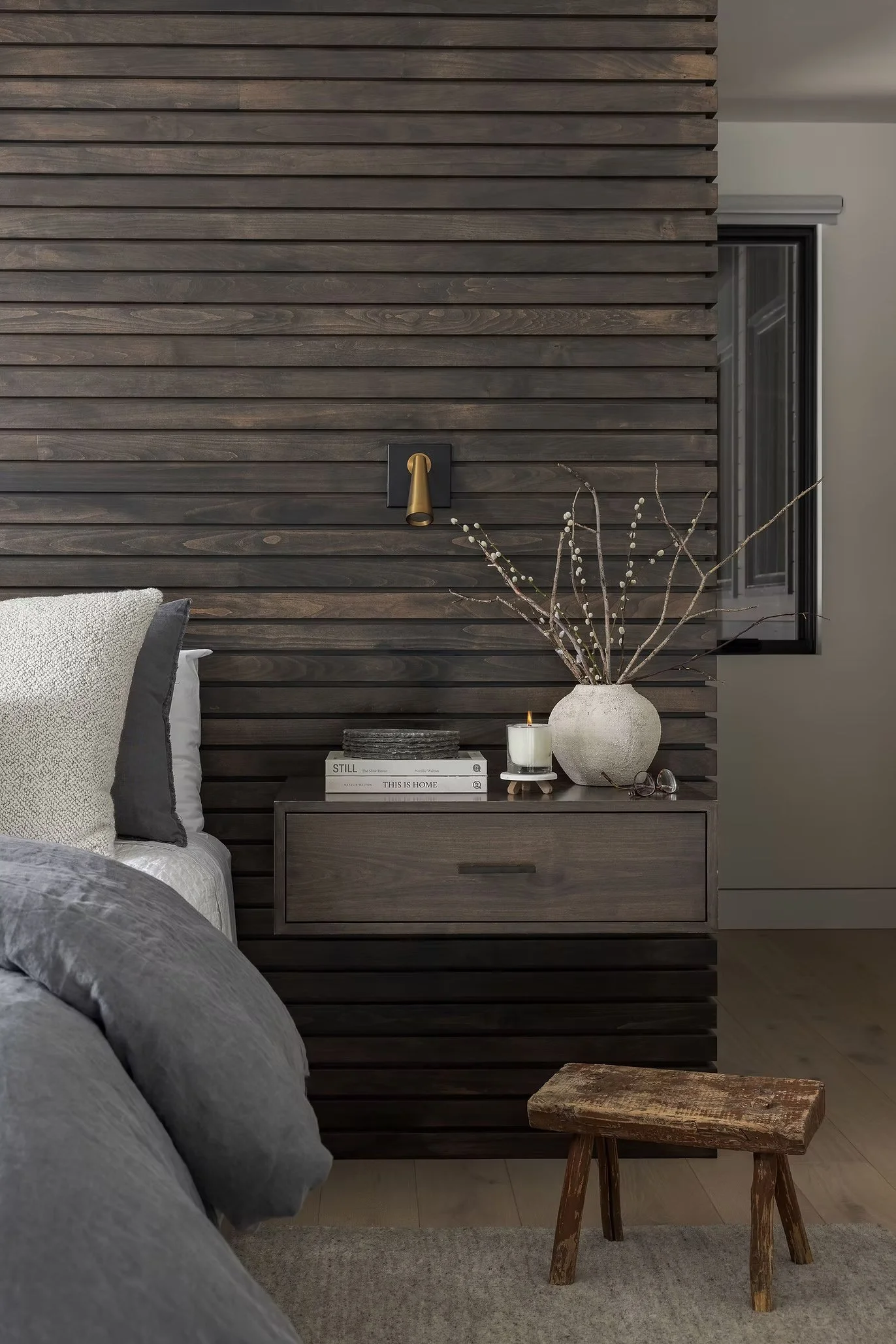bedroom with nightstand and wooden stool
