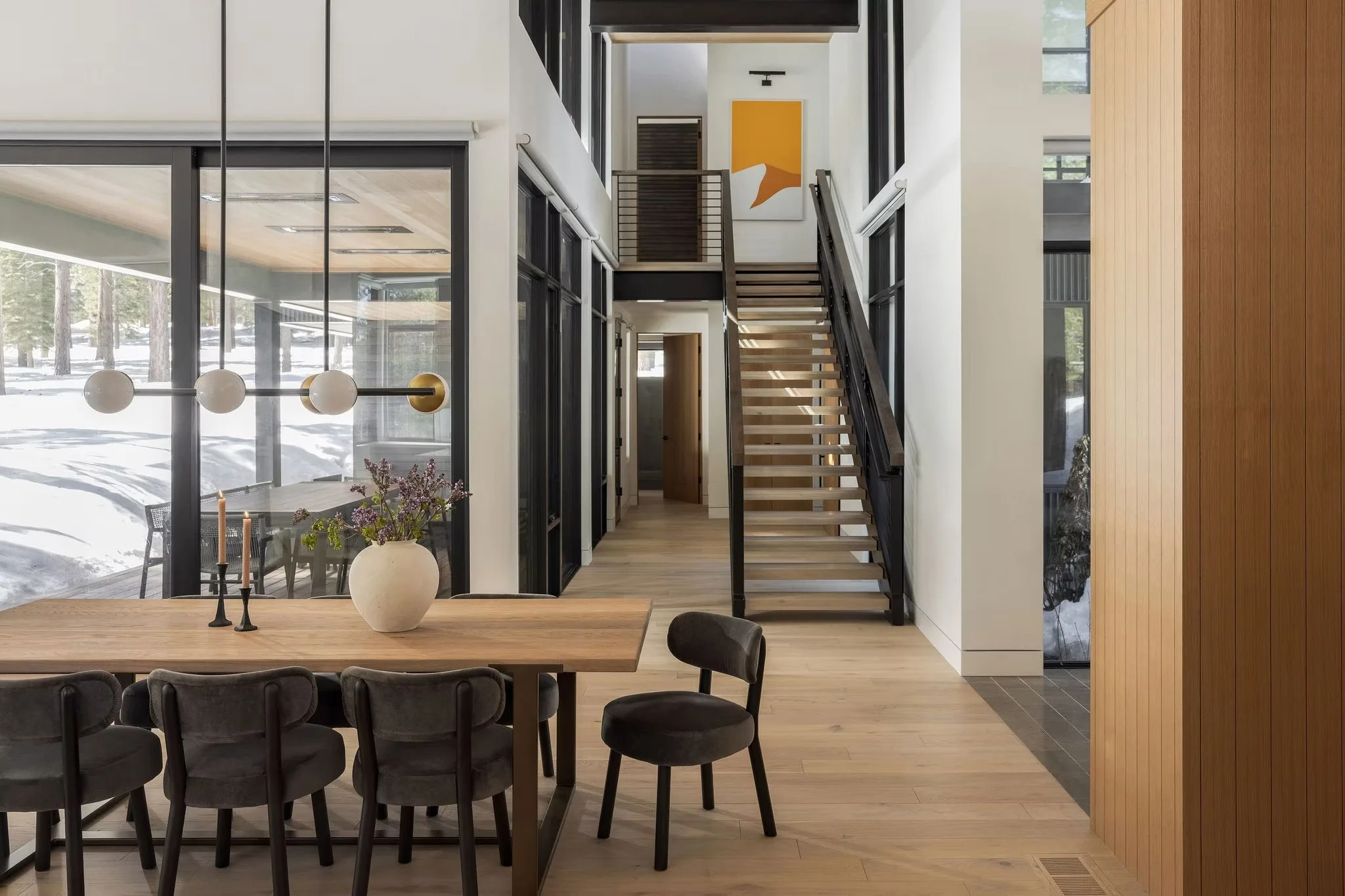 dining room with staircase to second floor behind