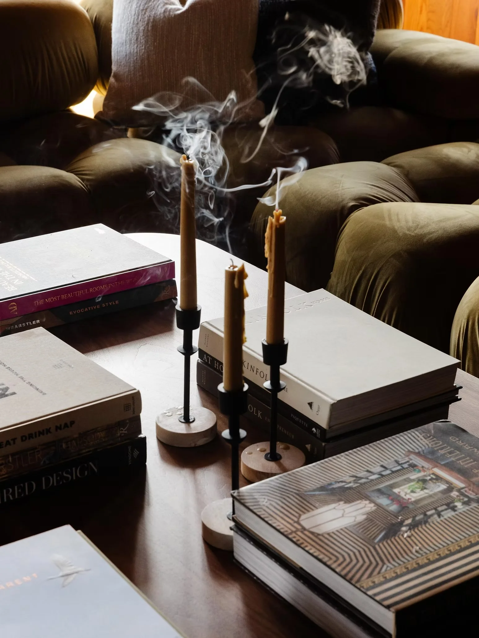 coffee table detail shot with candles and books