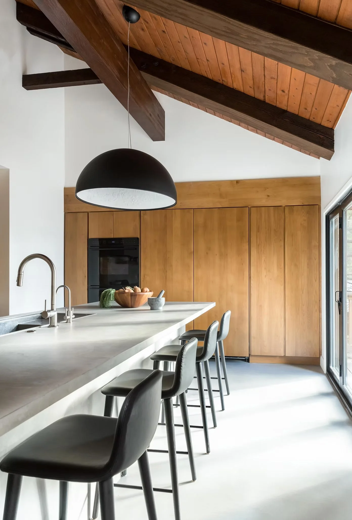 kitchen island with storage in background