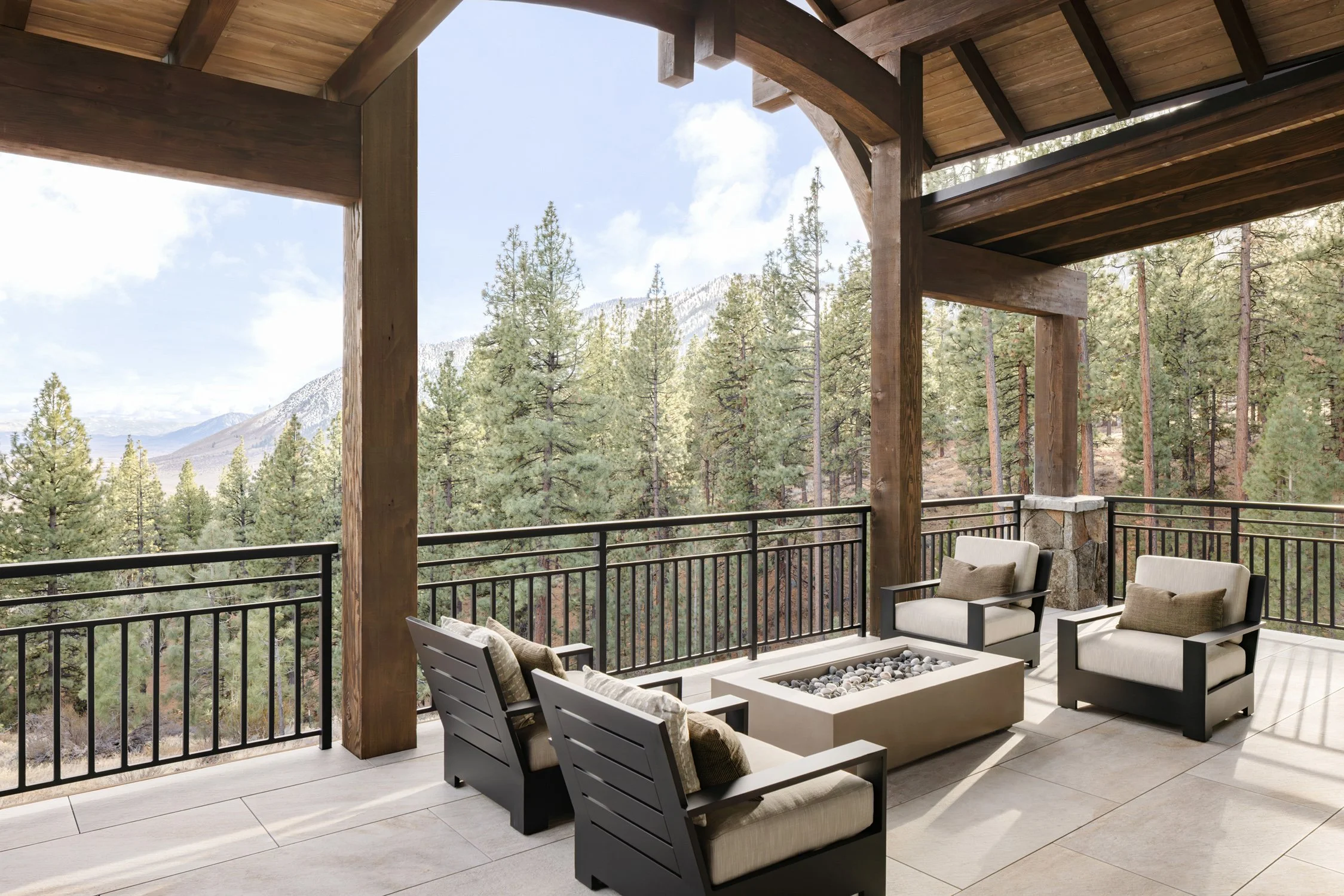balcony with chairs and fireplace