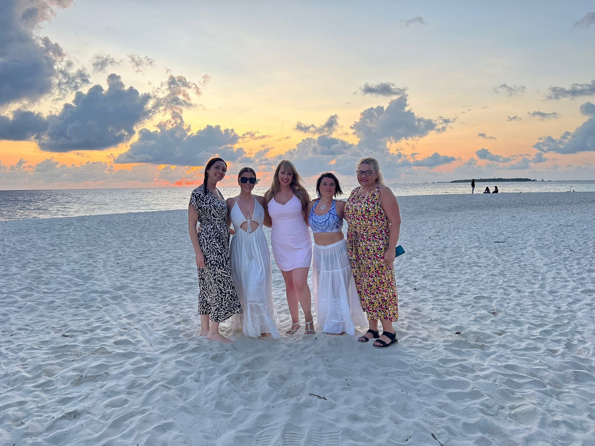 aRetreat group on the beach at sunset in the Maldives