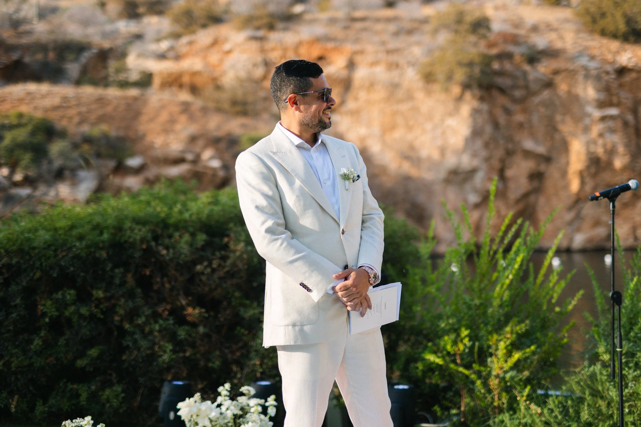 Groom waiting for bride Lake Vouliagmeni Athens Greece