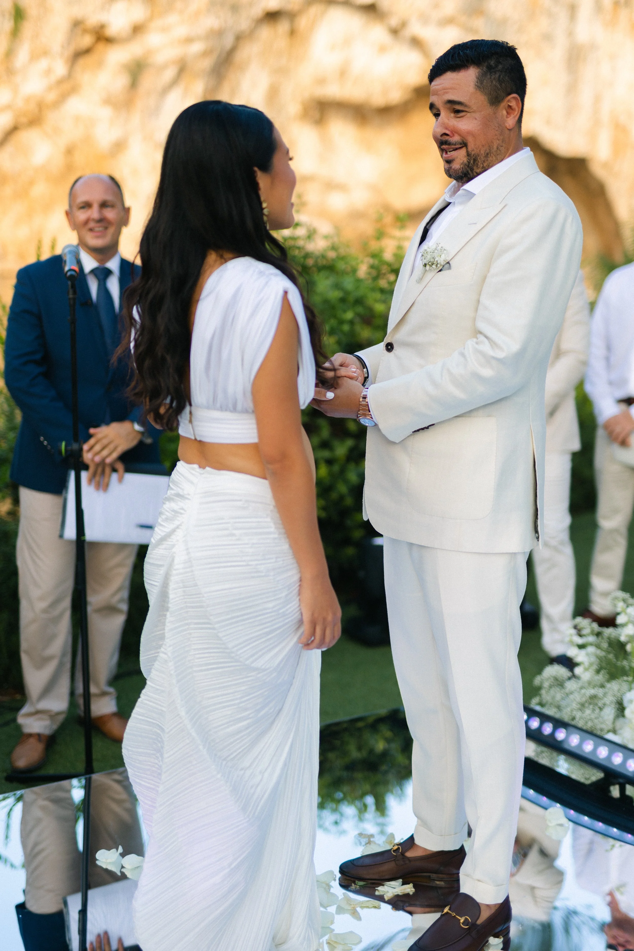 Emotional ceremony moment Lake Vouliagmeni Greece wedding