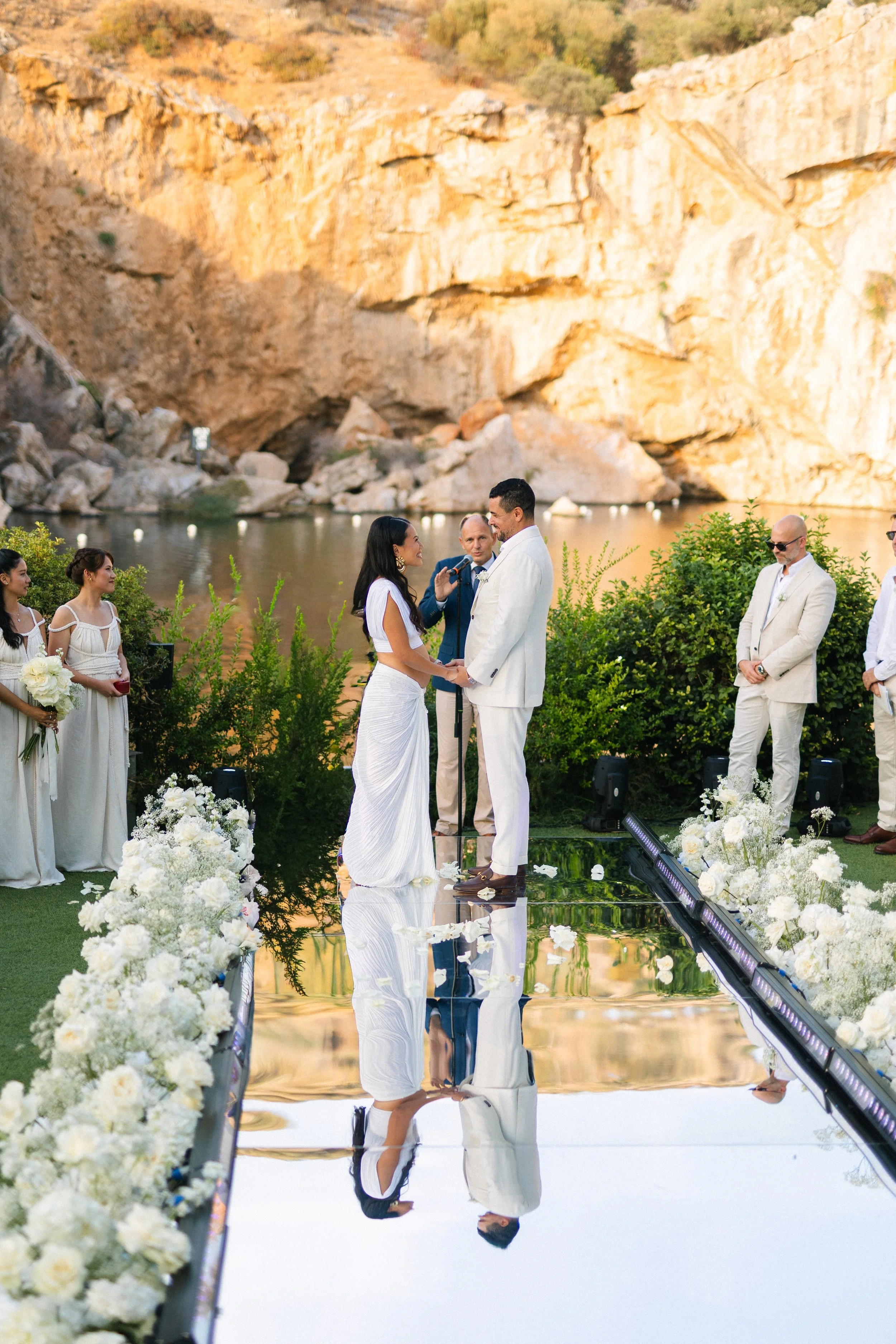 Emotional ceremony moment Lake Vouliagmeni Greece wedding