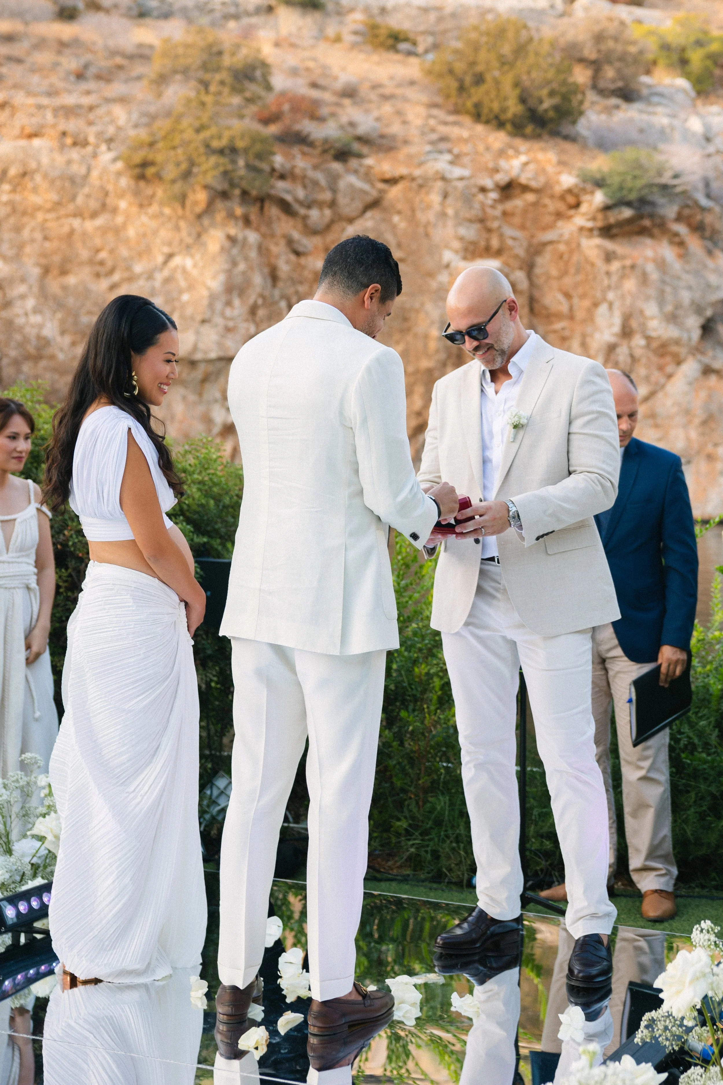 Emotional ceremony moment Lake Vouliagmeni Greece wedding