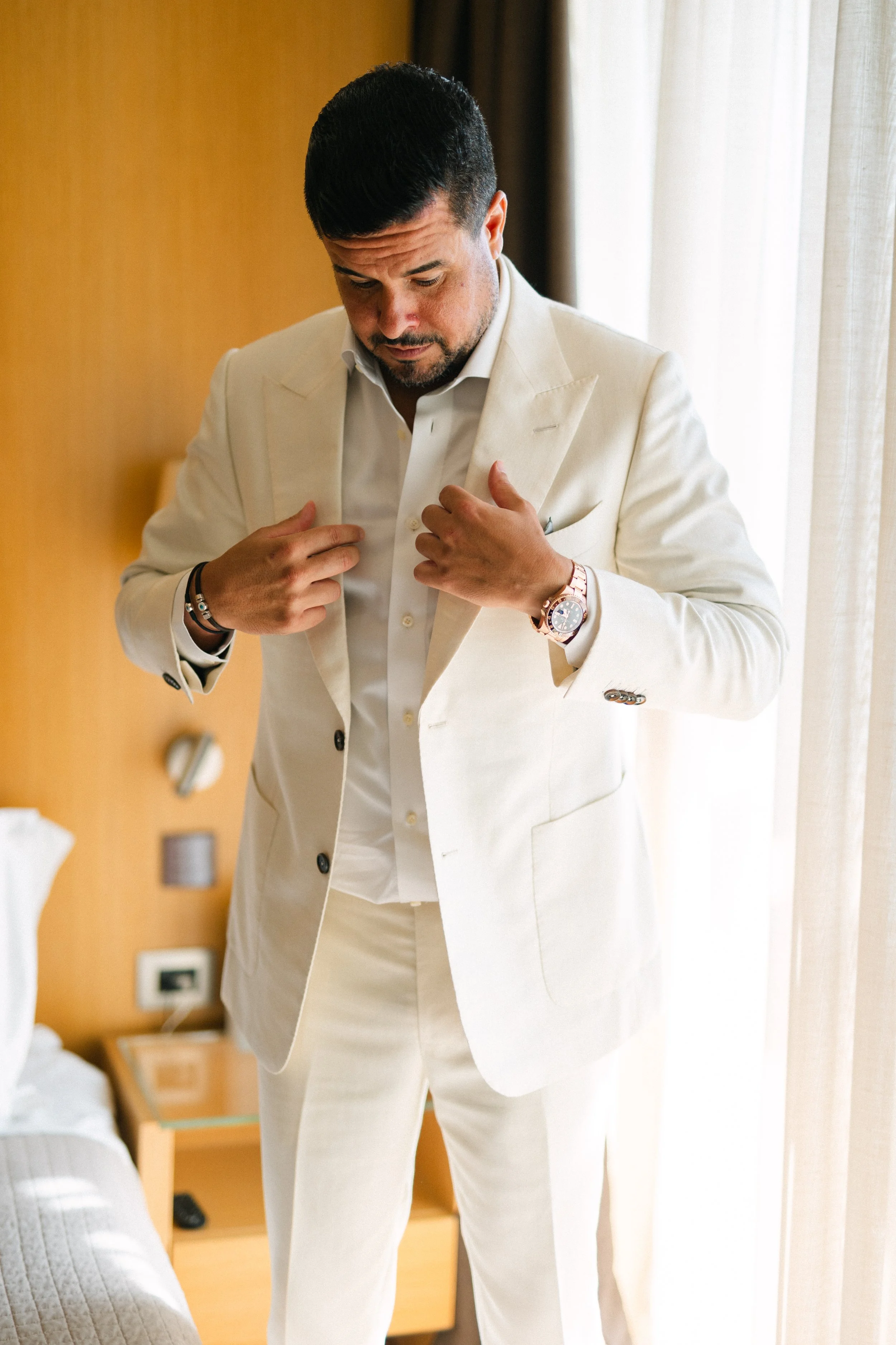 Groom getting ready Lake Vouliagmeni Athens Greece
