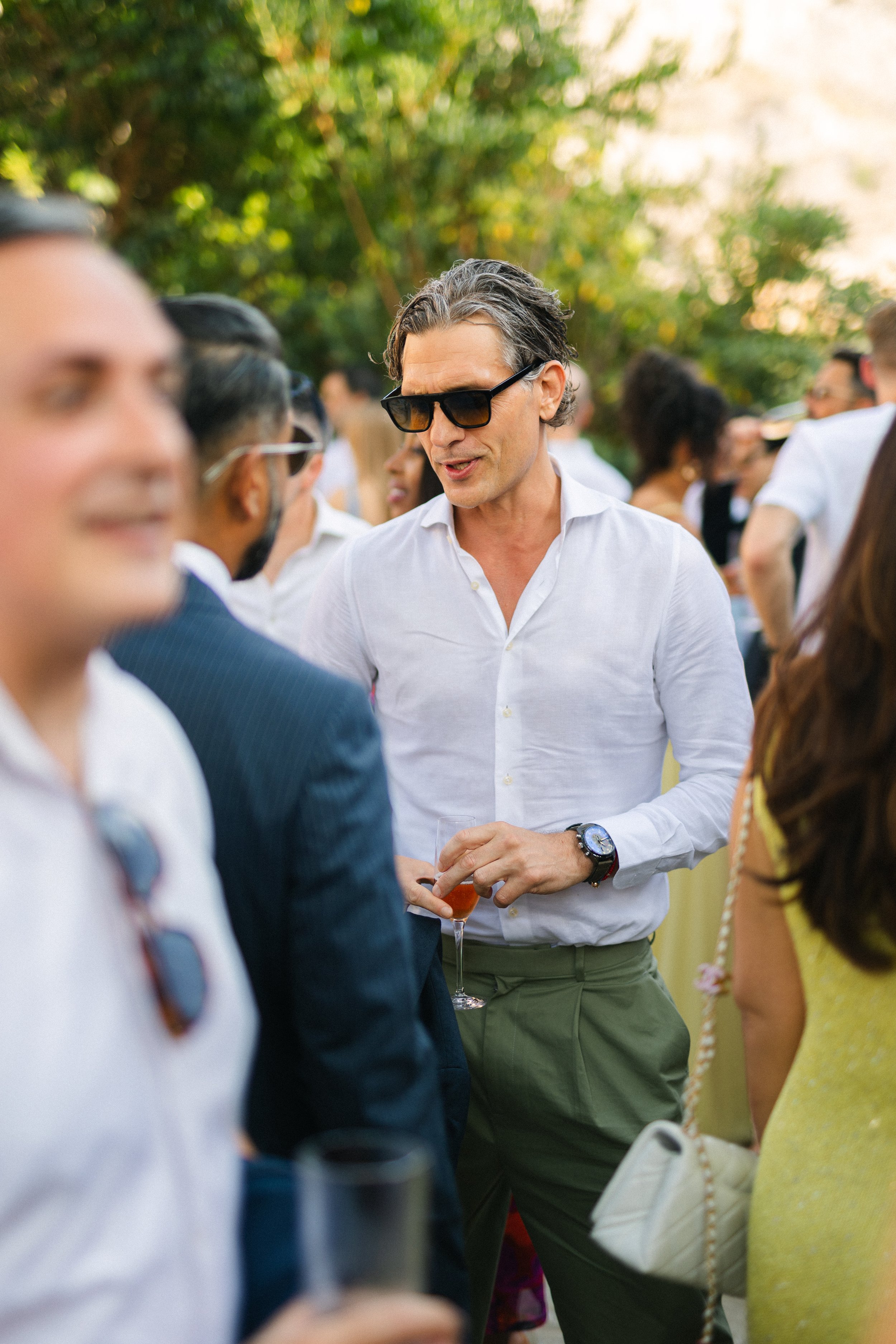 Guest laughing Lake Vouliagmeni Athens Greece wedding