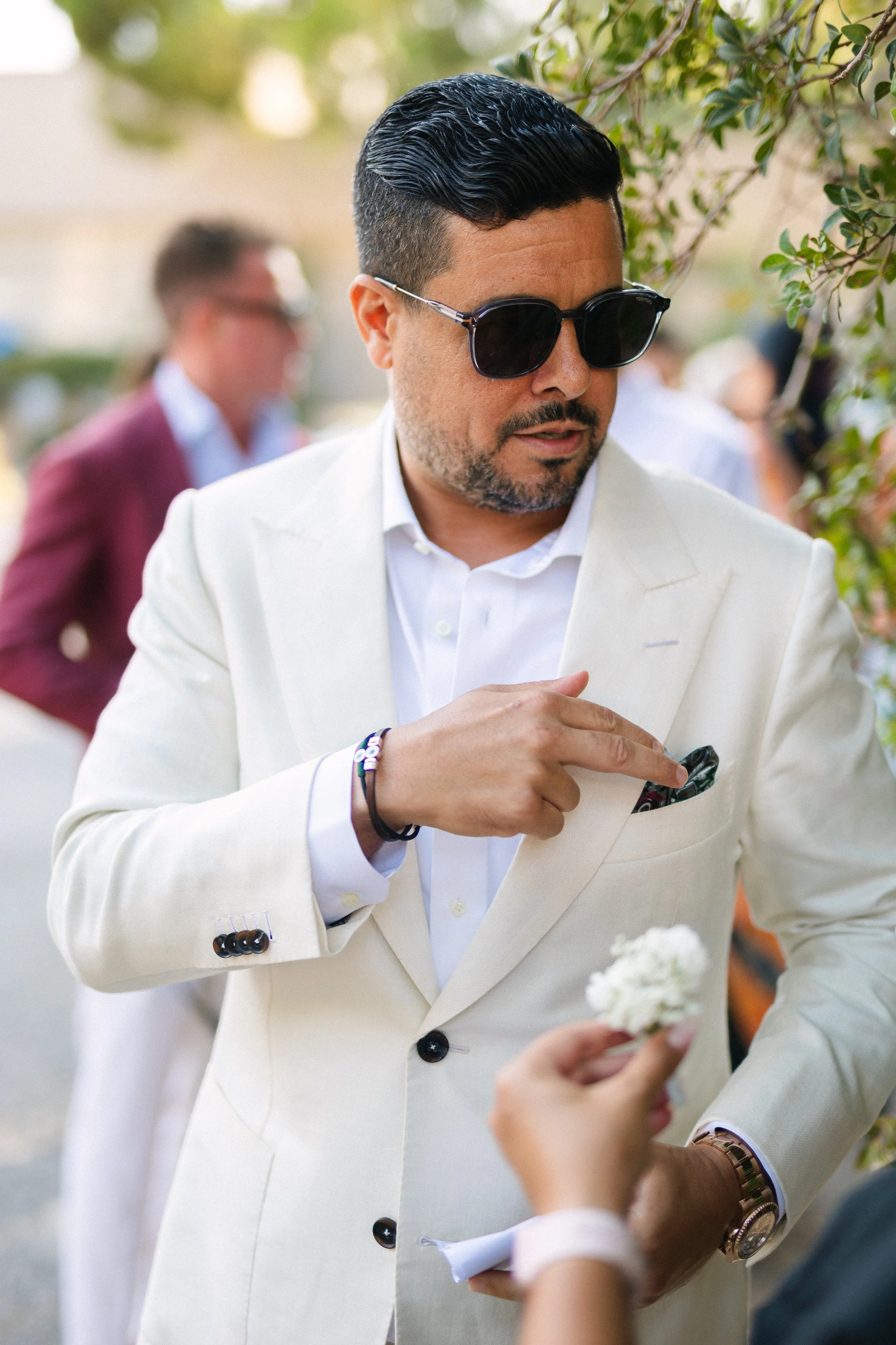 Groom getting ready for ceremony Lake Vouliagmeni athens greece