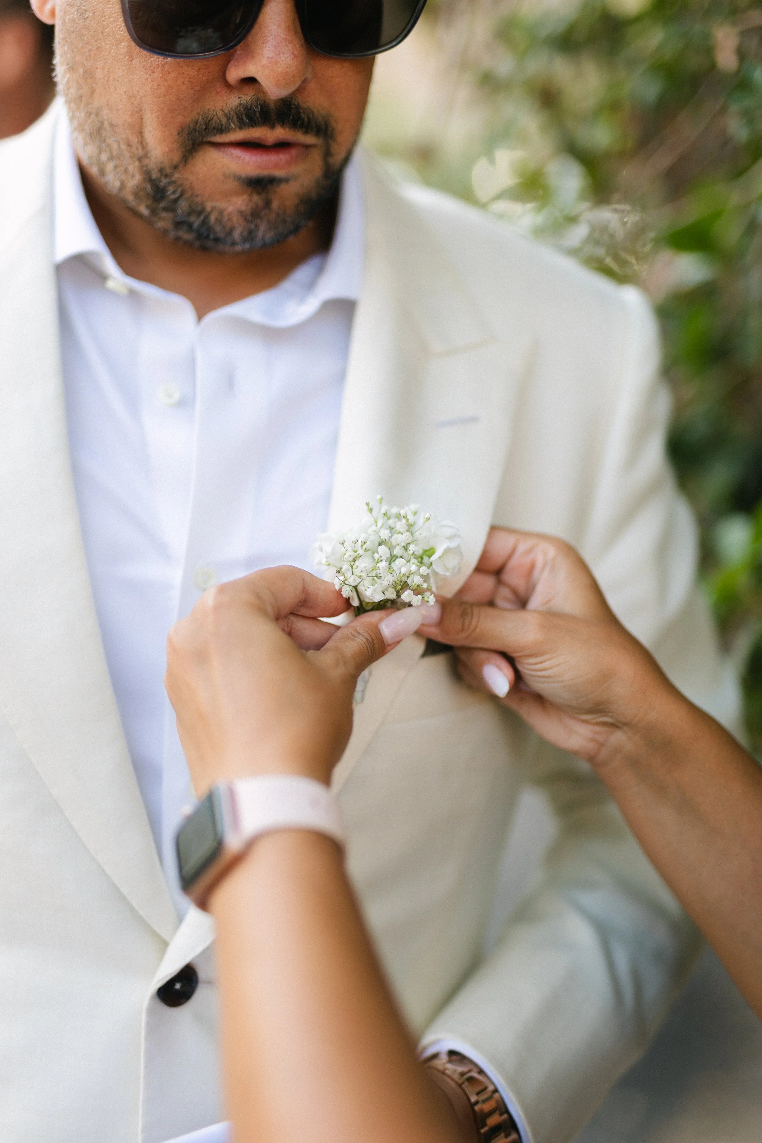 Groom getting ready for ceremony Lake Vouliagmeni athens greece