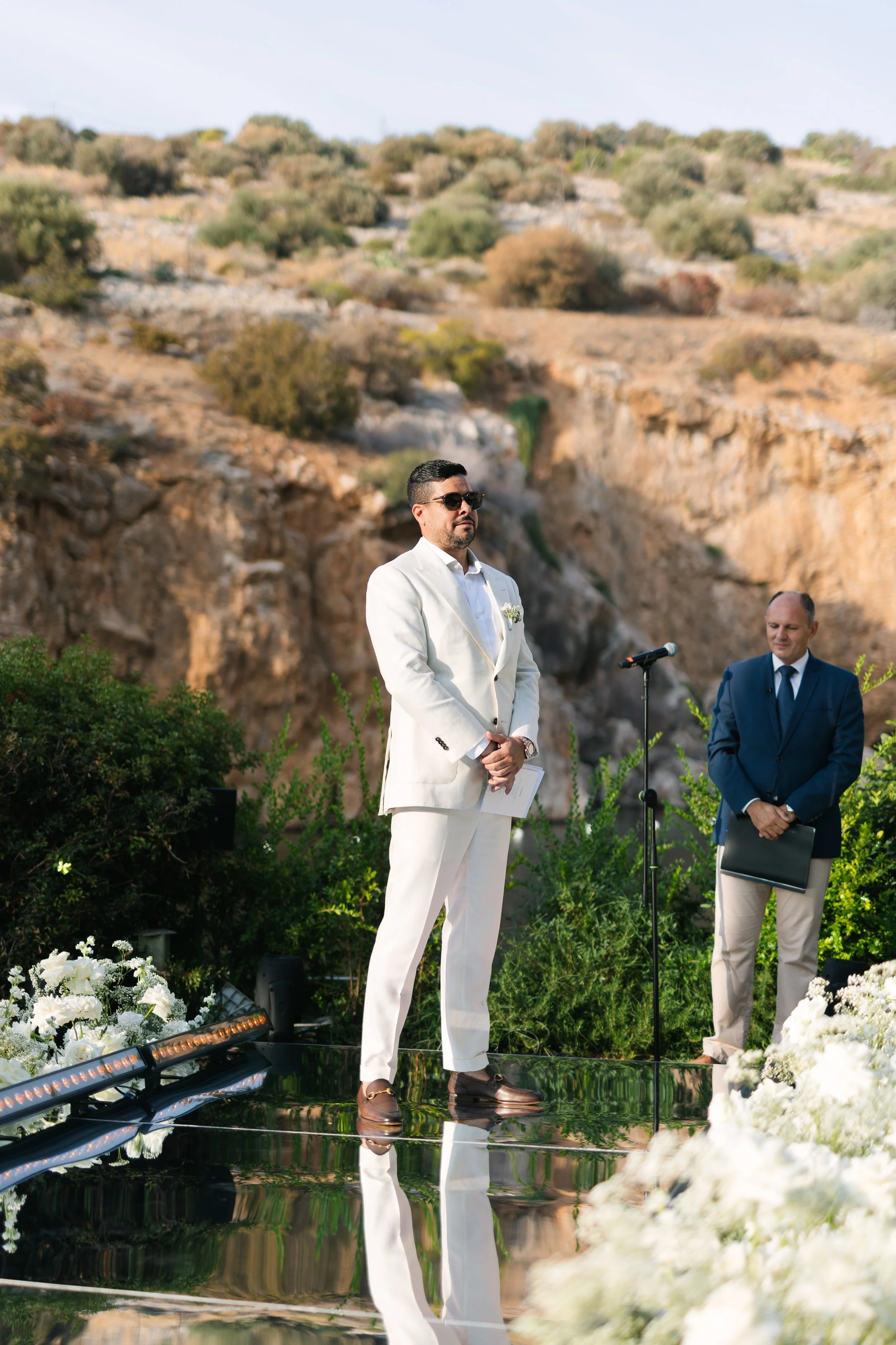 Groom nervous waiting Lake Vouliagmeni Athens Greece wedding