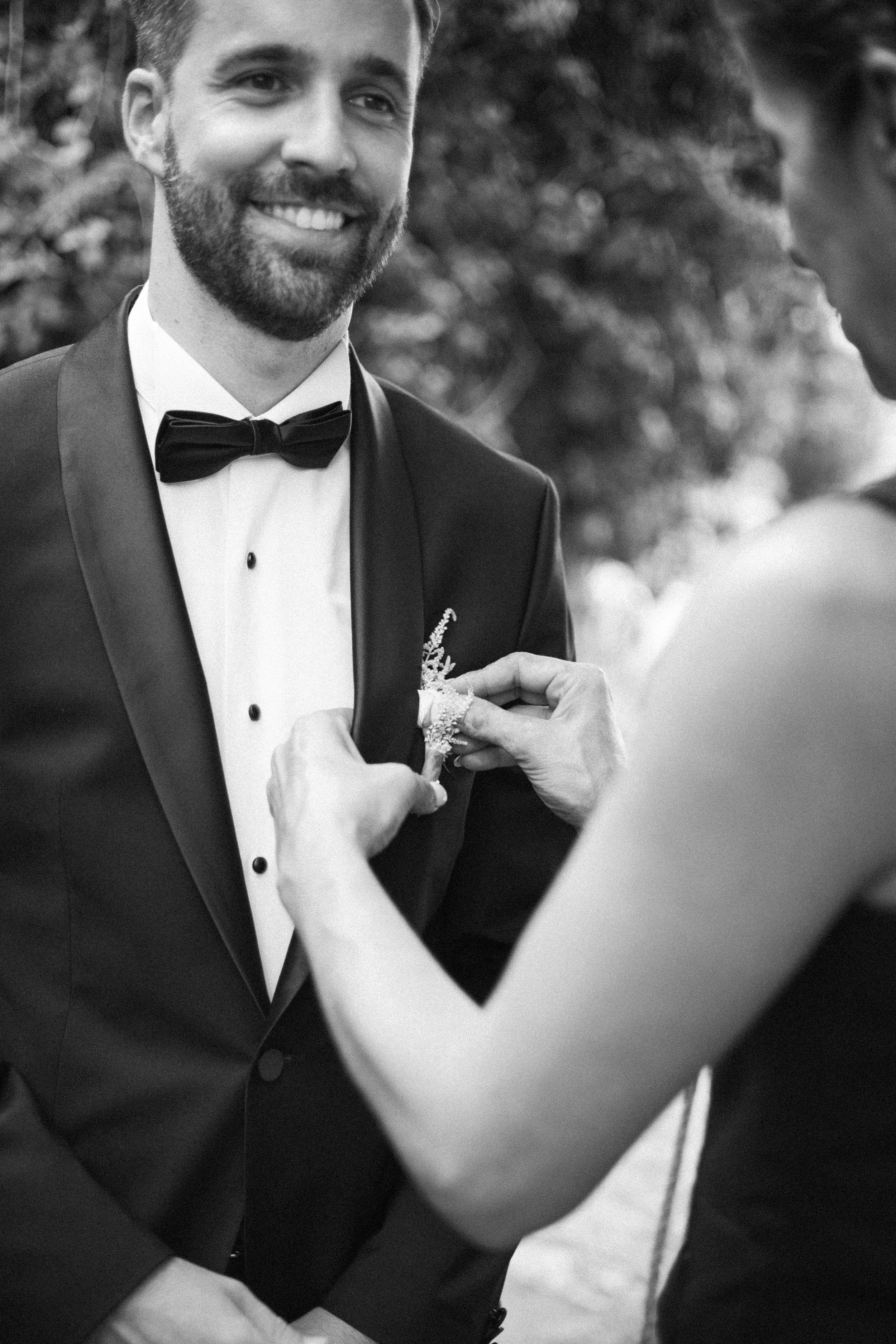 Groom getting ready Iliou Petra estate Athens Greece