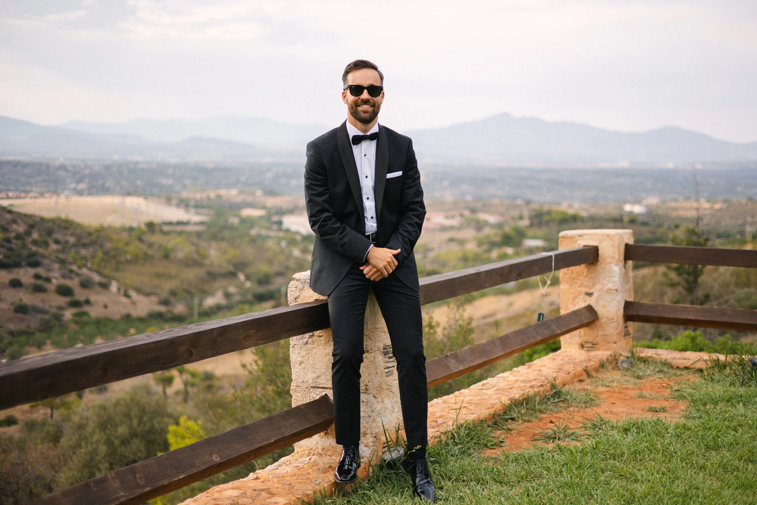 Groom standing at estate Iliou Petra Athens Greece wedding