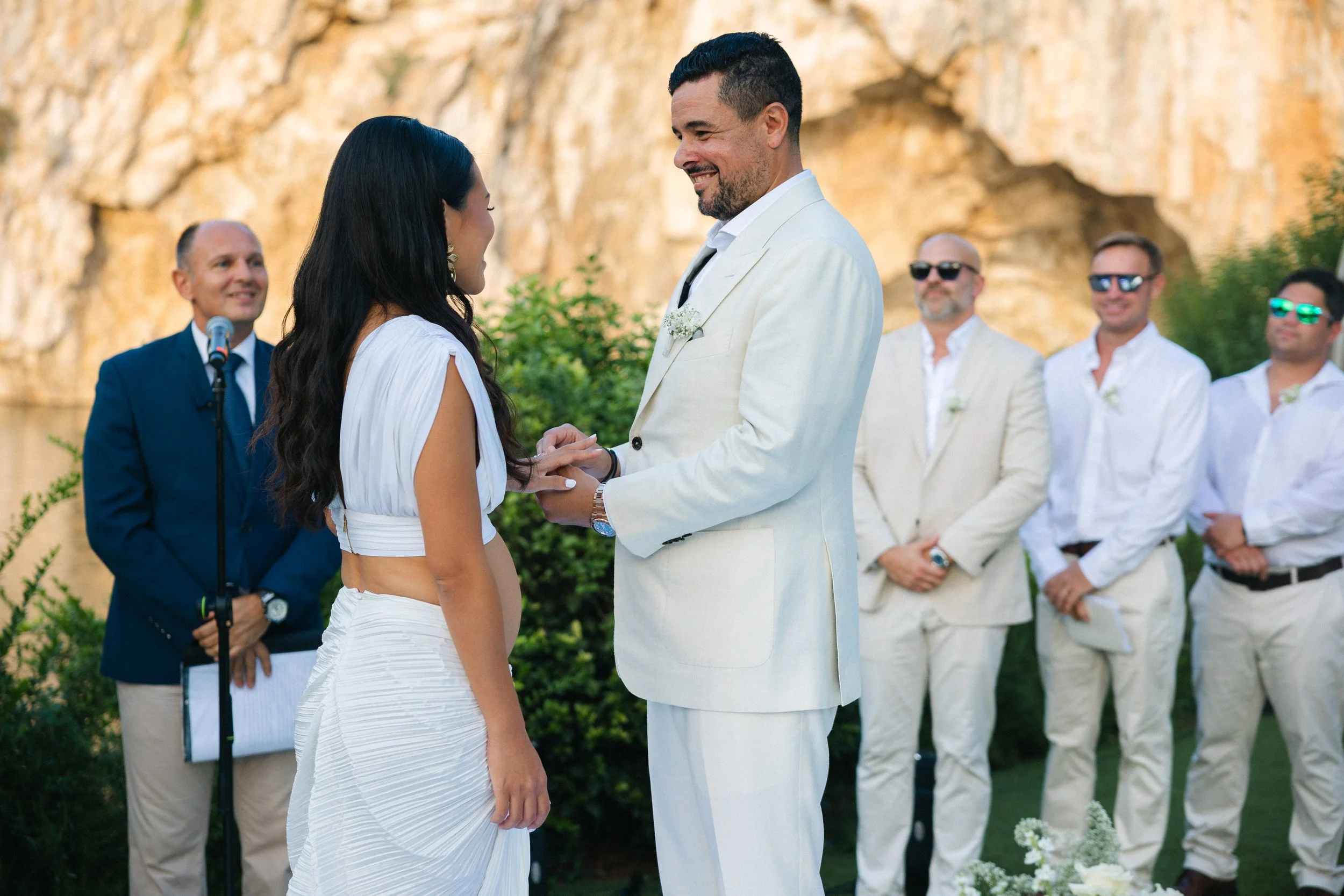 Emotional ceremony moment Lake Vouliagmeni Greece wedding