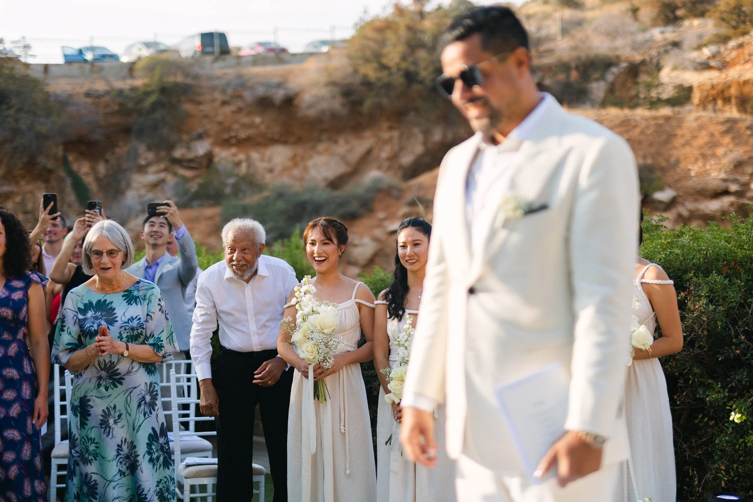 Groom emotional waiting for bride Lake Vouliagmeni Athens