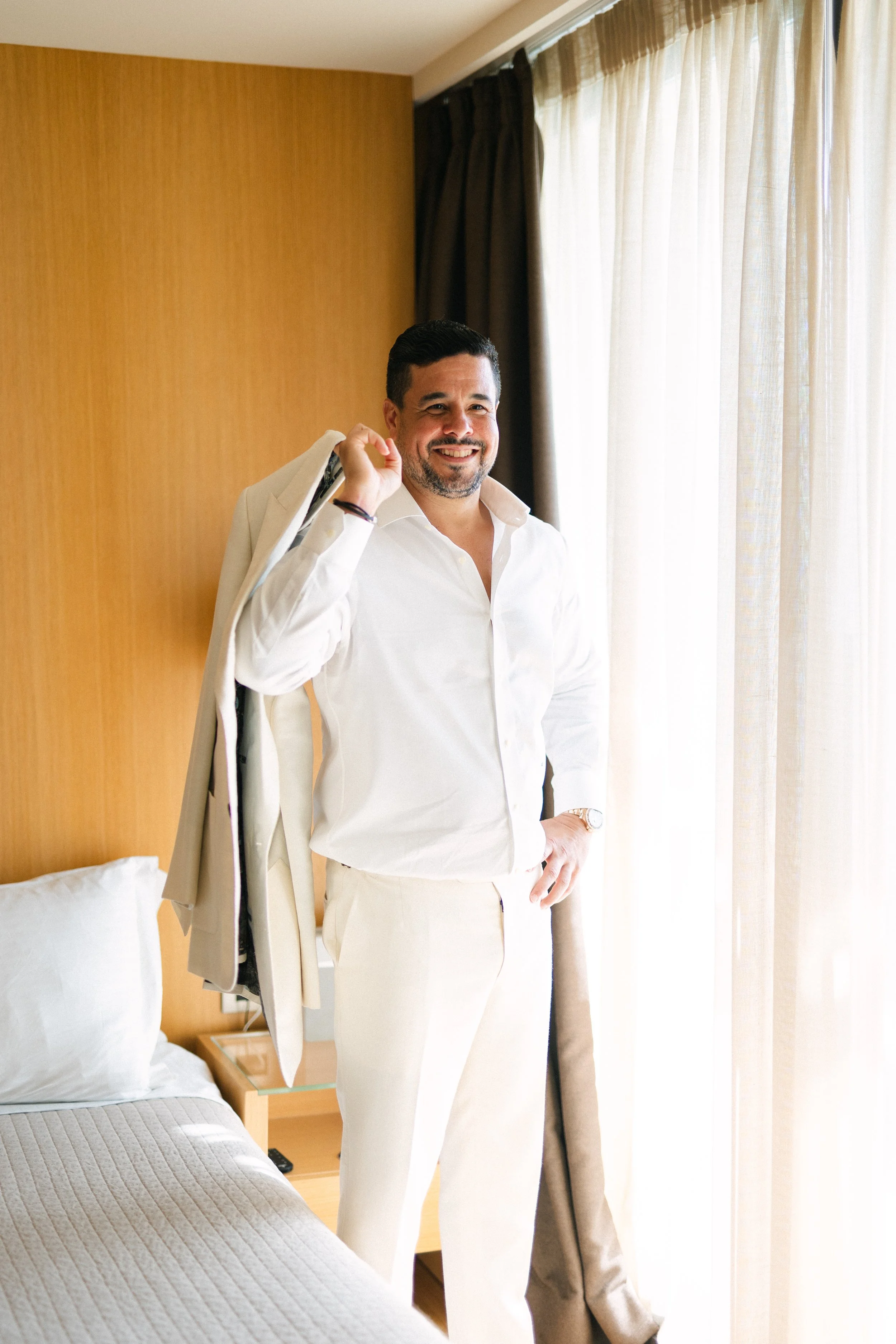 Groom getting ready Lake Vouliagmeni Athens Greece