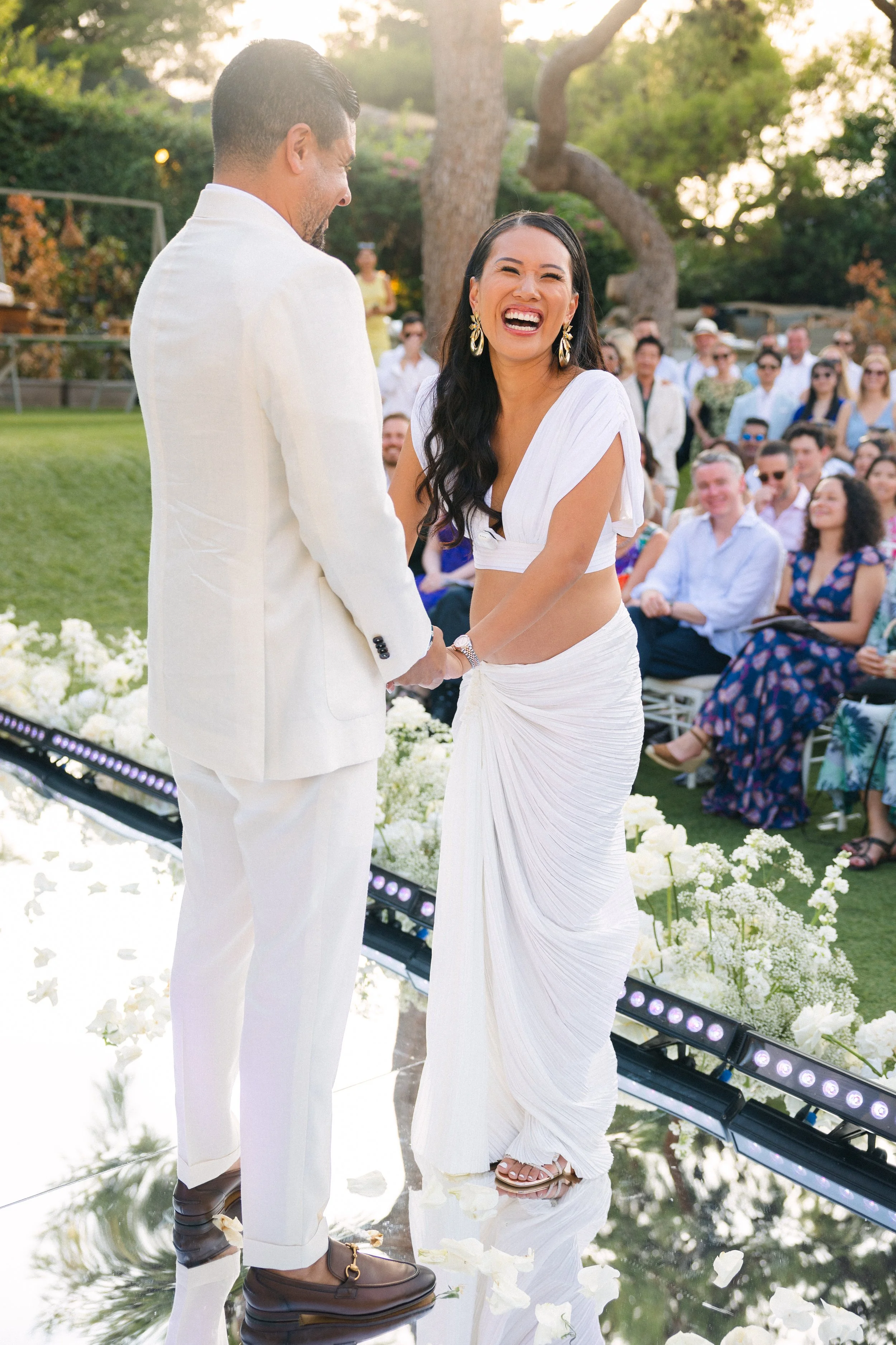 Bride laughs wedding ceremony Lake Vouliagmeni Athens Greece